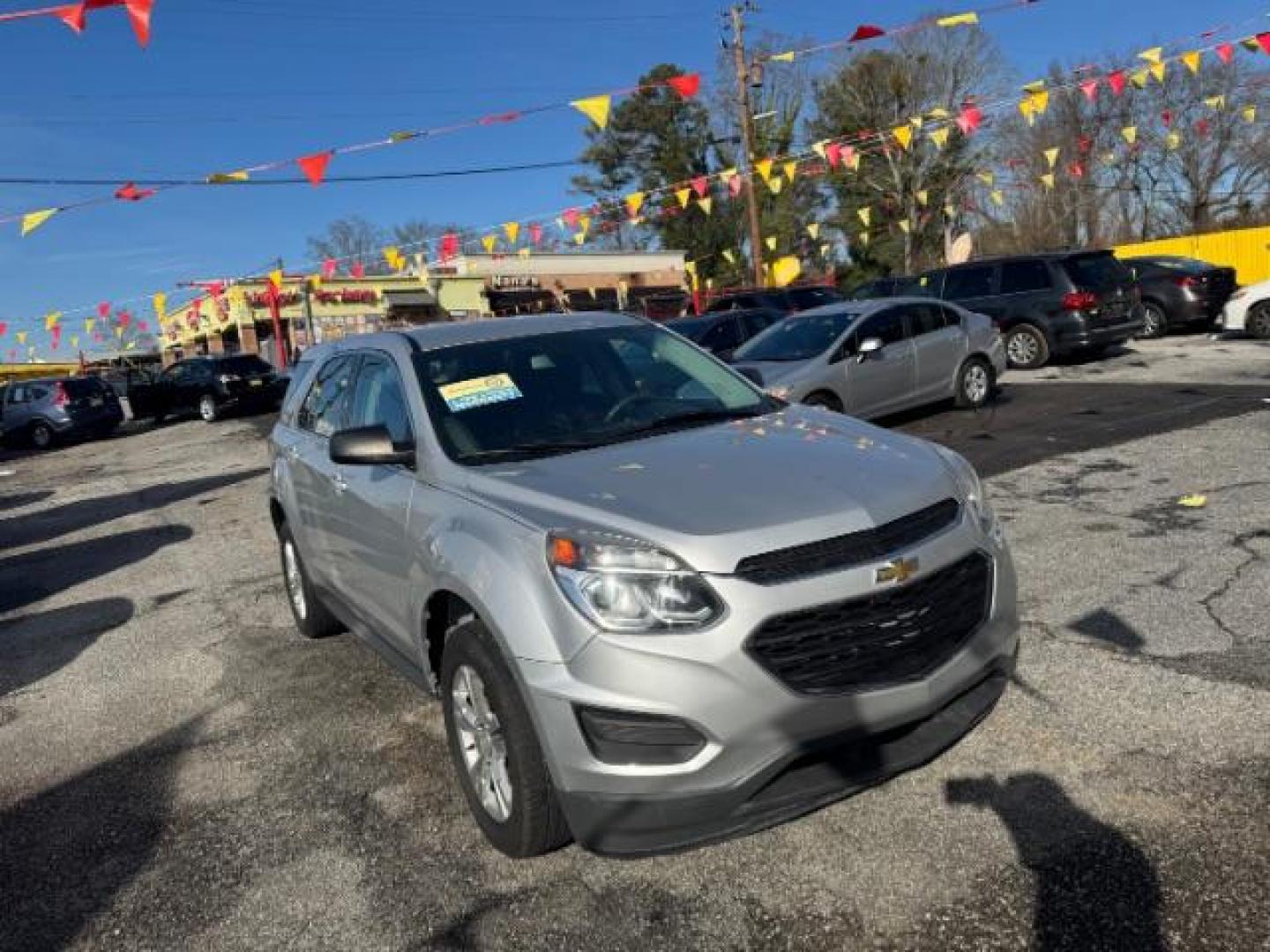 2017 Silver Chevrolet Equinox LS 2WD (2GNALBEK7H1) with an 2.4L L4 DOHC 16V FFV engine, 6-Speed Automatic transmission, located at 1806 Veterans Memorial Hwy SW, Austell, GA, 30168, (770) 944-9558, 33.817959, -84.606987 - Photo#1