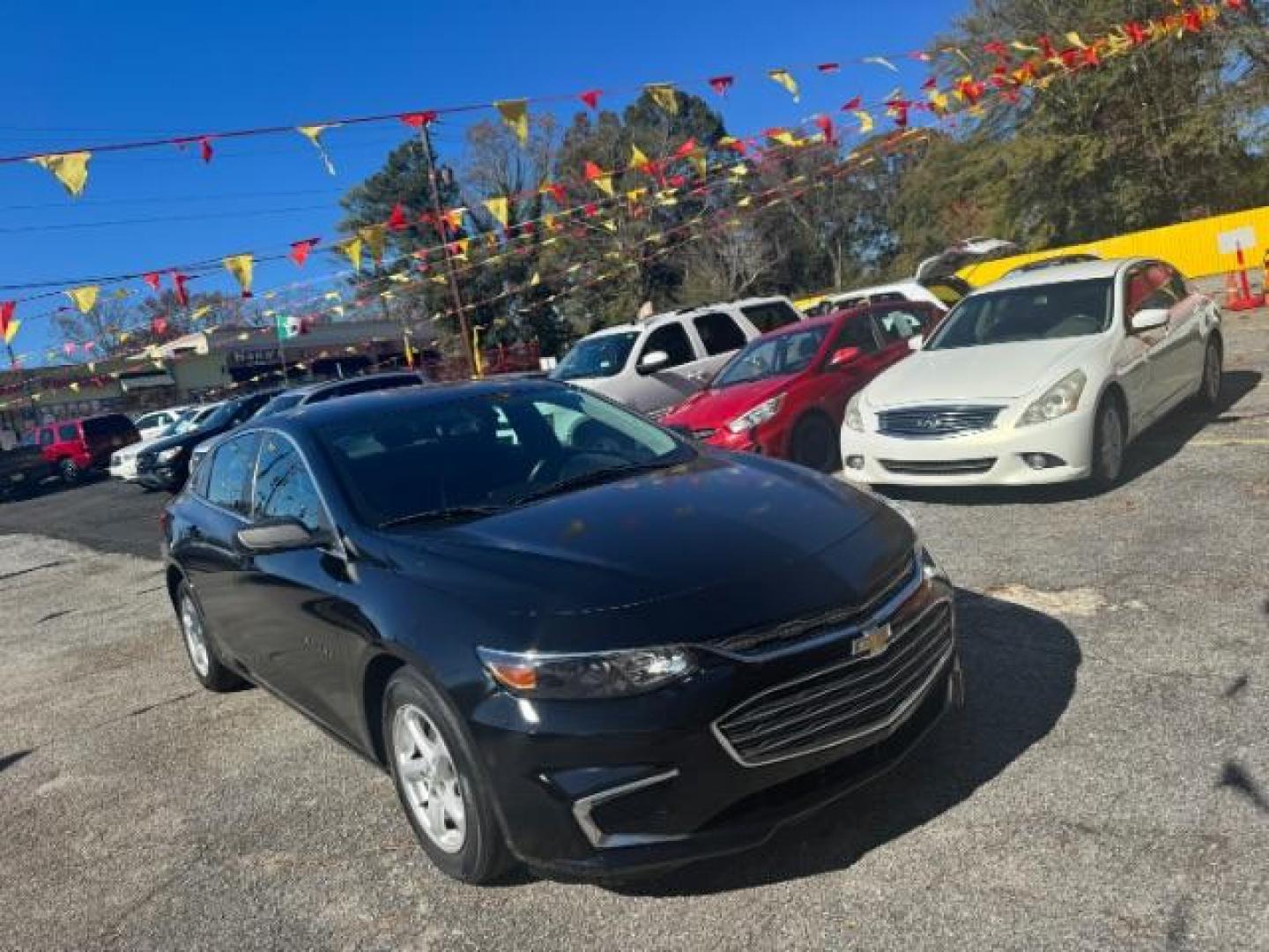 2017 Black Chevrolet Malibu LS (1G1ZB5ST0HF) with an 1.5L L4 DOHC 16V engine, 6-Speed Automatic transmission, located at 1806 Veterans Memorial Hwy SW, Austell, GA, 30168, (770) 944-9558, 33.817959, -84.606987 - Photo#2