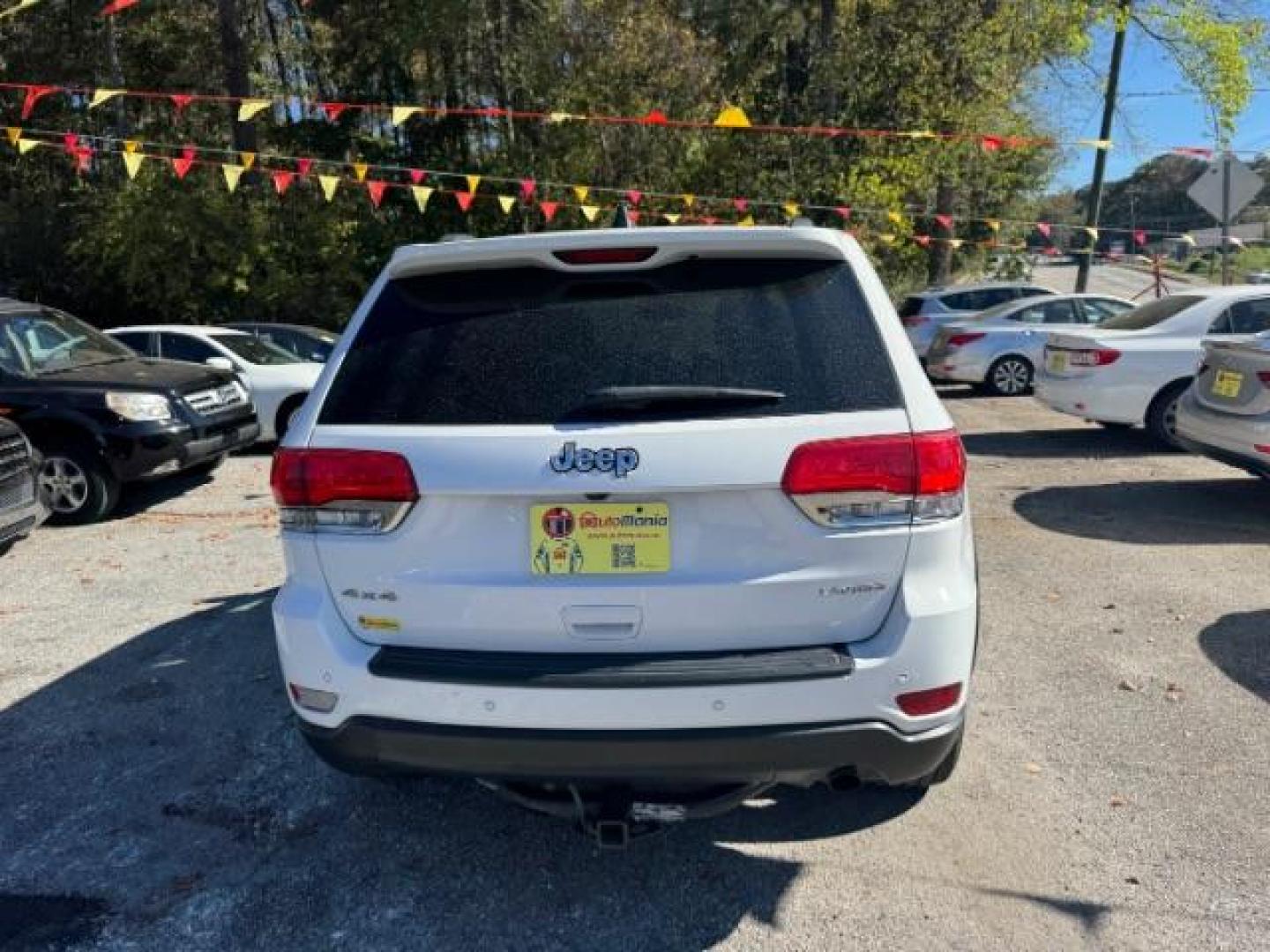 2017 White Jeep Grand Cherokee Laredo 4WD (1C4RJFAG0HC) with an 3.6L V6 DOHC 24V engine, 8-Speed Automatic transmission, located at 1806 Veterans Memorial Hwy SW, Austell, GA, 30168, (770) 944-9558, 33.817959, -84.606987 - Photo#4