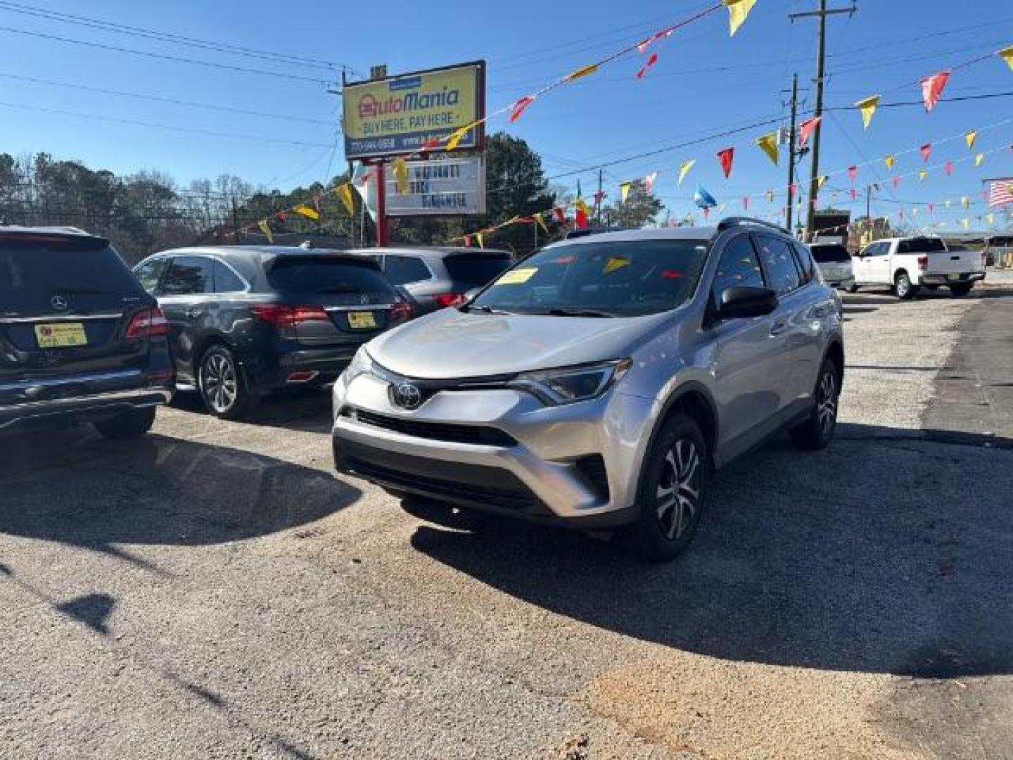 2018 Silver Toyota RAV4 LE FWD (2T3ZFREV3JW) with an 2.5L L4 DOHC 16V engine, 6-Speed Automatic transmission, located at 1806 Veterans Memorial Hwy SW, Austell, GA, 30168, (770) 944-9558, 33.817959, -84.606987 - Photo#0