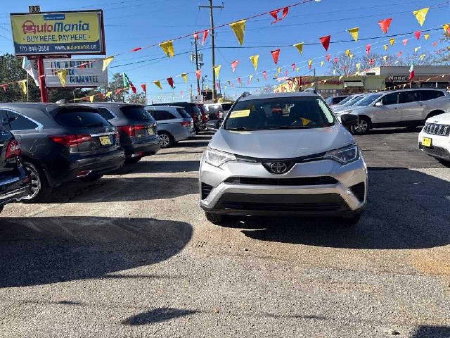 2018 Silver Toyota RAV4 LE FWD (2T3ZFREV3JW) with an 2.5L L4 DOHC 16V engine, 6-Speed Automatic transmission, located at 1806 Veterans Memorial Hwy SW, Austell, GA, 30168, (770) 944-9558, 33.817959, -84.606987 - Photo#1