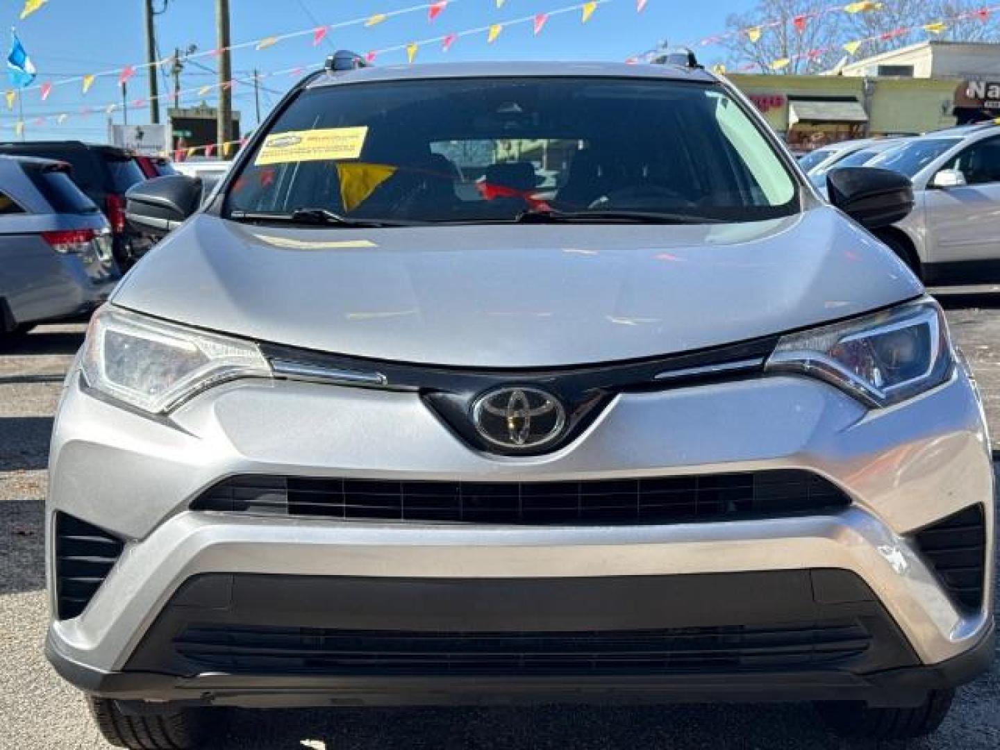 2018 Silver Toyota RAV4 LE FWD (2T3ZFREV3JW) with an 2.5L L4 DOHC 16V engine, 6-Speed Automatic transmission, located at 1806 Veterans Memorial Hwy SW, Austell, GA, 30168, (770) 944-9558, 33.817959, -84.606987 - Photo#2