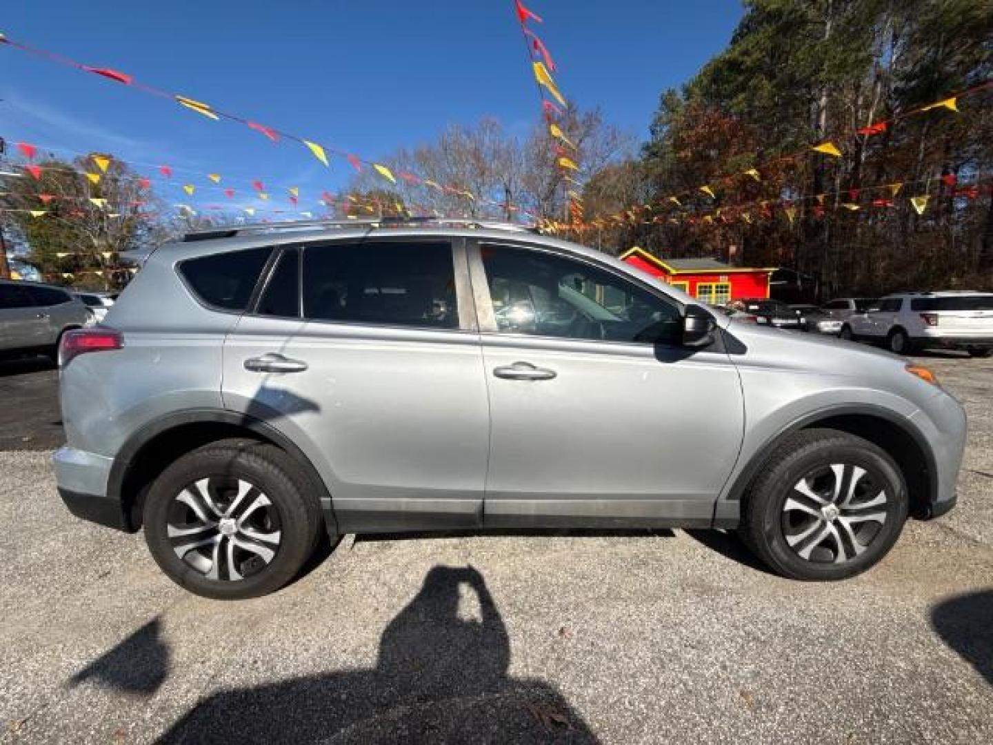 2018 Silver Toyota RAV4 LE FWD (2T3ZFREV3JW) with an 2.5L L4 DOHC 16V engine, 6-Speed Automatic transmission, located at 1806 Veterans Memorial Hwy SW, Austell, GA, 30168, (770) 944-9558, 33.817959, -84.606987 - Photo#3