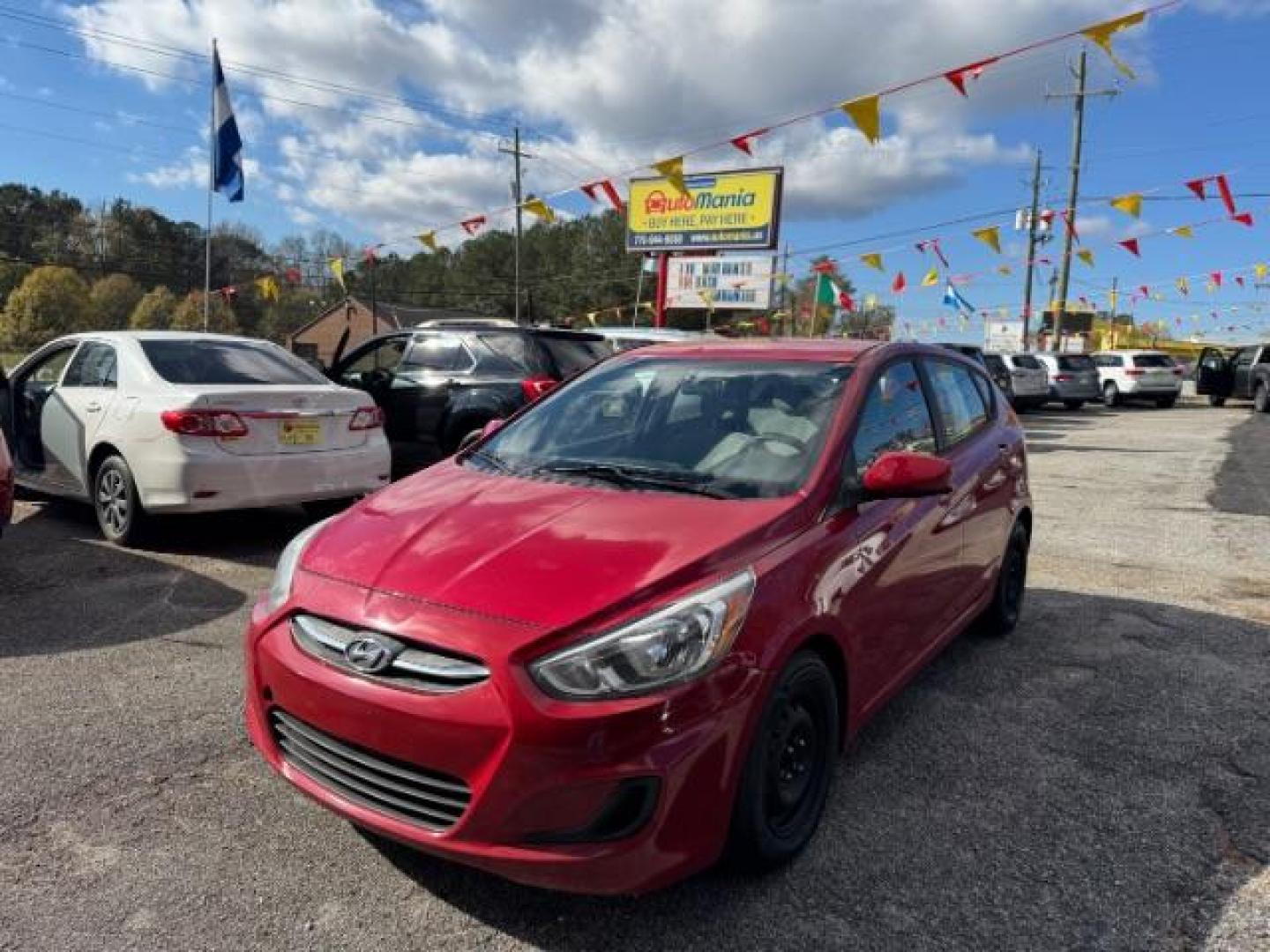 2017 Red Hyundai Accent SE 5-Door 6A (KMHCT5AE0HU) with an 1.6L L4 DOHC 16V engine, 6-Speed Automatic transmission, located at 1806 Veterans Memorial Hwy SW, Austell, GA, 30168, (770) 944-9558, 33.817959, -84.606987 - Photo#0