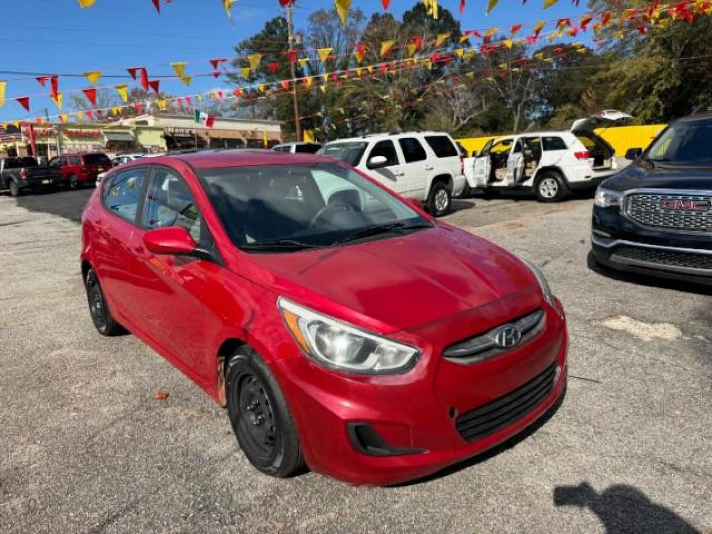 2017 Red Hyundai Accent SE 5-Door 6A (KMHCT5AE0HU) with an 1.6L L4 DOHC 16V engine, 6-Speed Automatic transmission, located at 1806 Veterans Memorial Hwy SW, Austell, GA, 30168, (770) 944-9558, 33.817959, -84.606987 - Photo#2