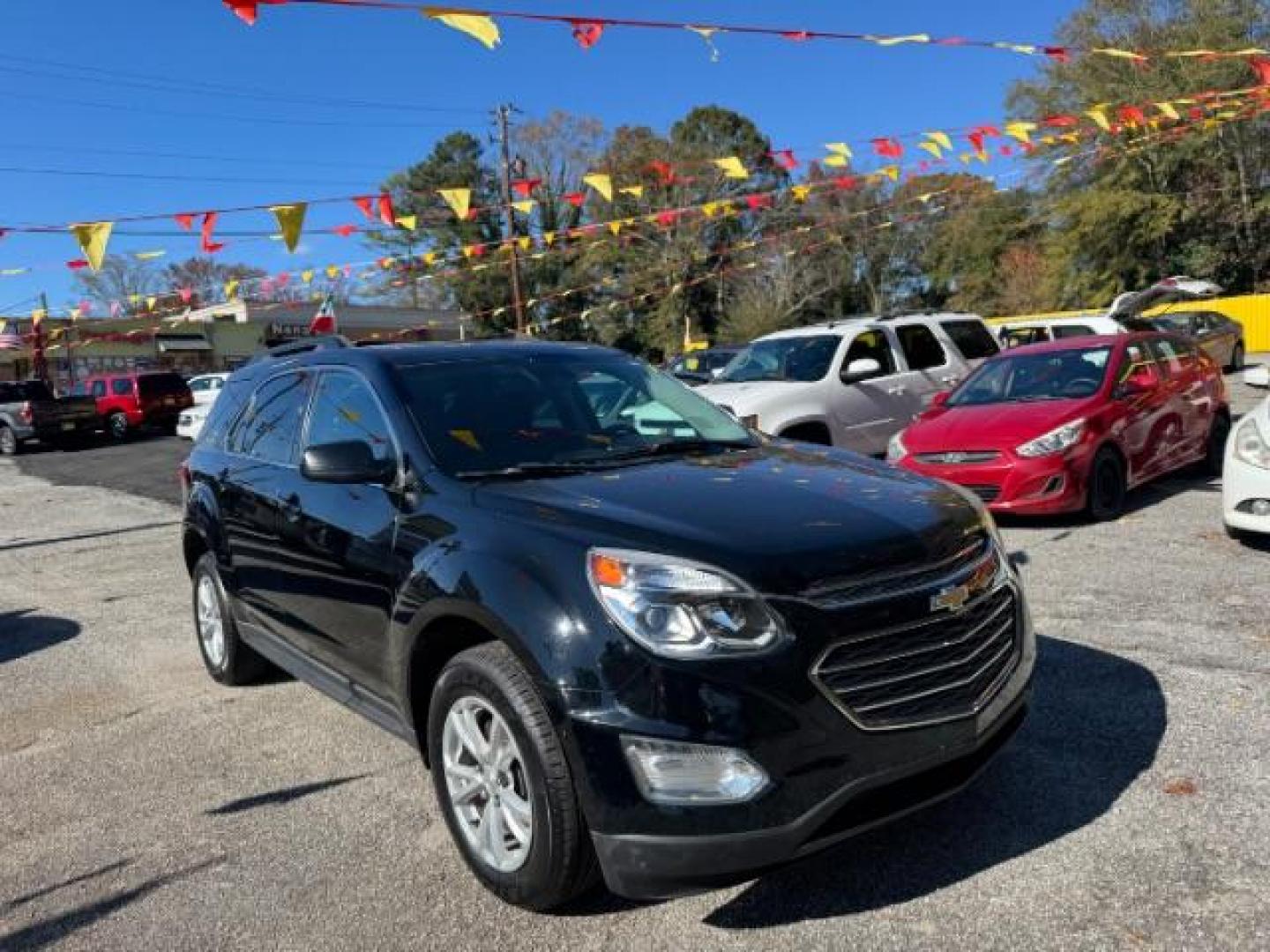 2016 Black Chevrolet Equinox LT AWD (2GNFLFEK6G6) with an 2.4L L4 DOHC 16V FFV engine, 6-Speed Automatic transmission, located at 1806 Veterans Memorial Hwy SW, Austell, GA, 30168, (770) 944-9558, 33.817959, -84.606987 - Photo#2