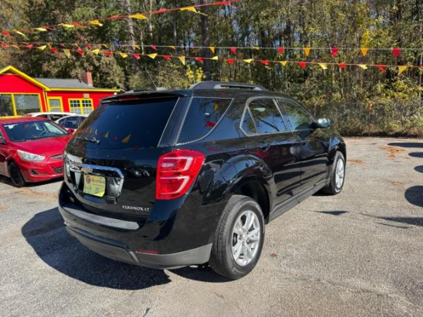 2016 Black Chevrolet Equinox LT AWD (2GNFLFEK6G6) with an 2.4L L4 DOHC 16V FFV engine, 6-Speed Automatic transmission, located at 1806 Veterans Memorial Hwy SW, Austell, GA, 30168, (770) 944-9558, 33.817959, -84.606987 - Photo#3