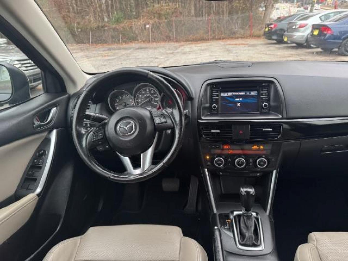 2015 Black Mazda CX-5 Grand Touring AWD (JM3KE4DY3F0) with an 2.5L L4 DOHC 16V engine, 6-Speed Automatic transmission, located at 1806 Veterans Memorial Hwy SW, Austell, GA, 30168, (770) 944-9558, 33.817959, -84.606987 - Photo#12