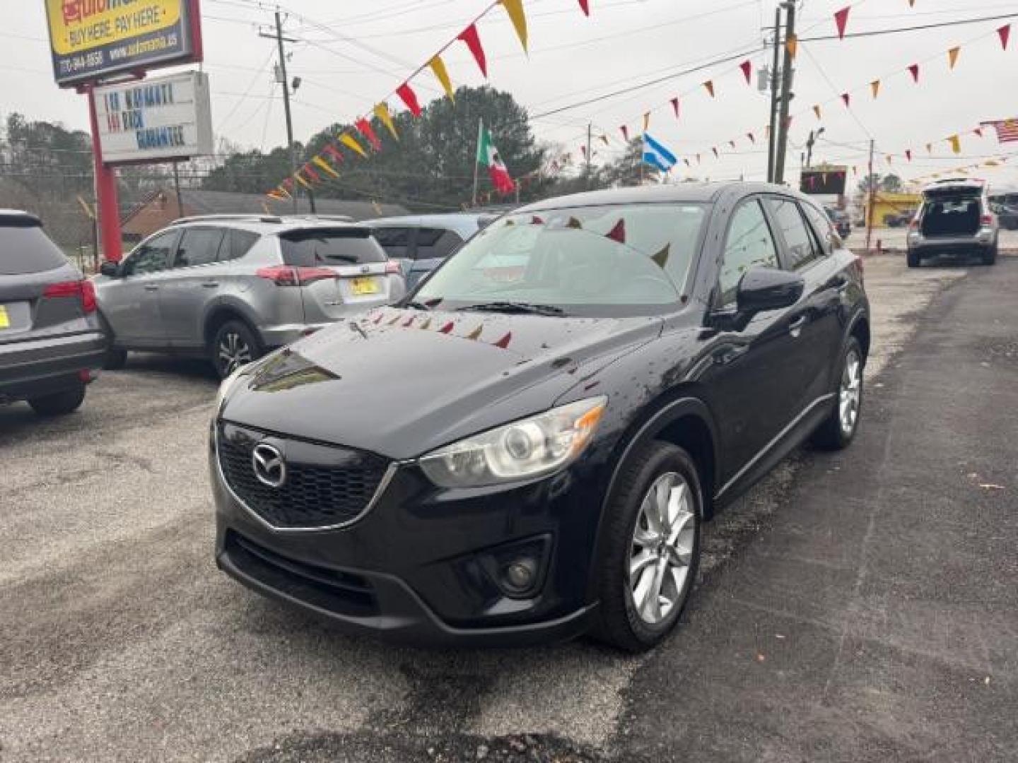 2015 Black Mazda CX-5 Grand Touring AWD (JM3KE4DY3F0) with an 2.5L L4 DOHC 16V engine, 6-Speed Automatic transmission, located at 1806 Veterans Memorial Hwy SW, Austell, GA, 30168, (770) 944-9558, 33.817959, -84.606987 - Photo#0