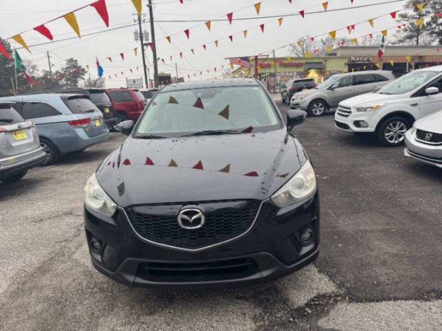 2015 Black Mazda CX-5 Grand Touring AWD (JM3KE4DY3F0) with an 2.5L L4 DOHC 16V engine, 6-Speed Automatic transmission, located at 1806 Veterans Memorial Hwy SW, Austell, GA, 30168, (770) 944-9558, 33.817959, -84.606987 - Photo#1