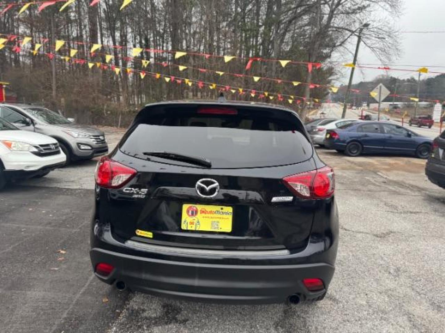 2015 Black Mazda CX-5 Grand Touring AWD (JM3KE4DY3F0) with an 2.5L L4 DOHC 16V engine, 6-Speed Automatic transmission, located at 1806 Veterans Memorial Hwy SW, Austell, GA, 30168, (770) 944-9558, 33.817959, -84.606987 - Photo#4