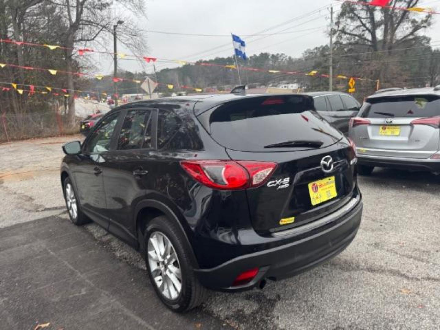 2015 Black Mazda CX-5 Grand Touring AWD (JM3KE4DY3F0) with an 2.5L L4 DOHC 16V engine, 6-Speed Automatic transmission, located at 1806 Veterans Memorial Hwy SW, Austell, GA, 30168, (770) 944-9558, 33.817959, -84.606987 - Photo#5