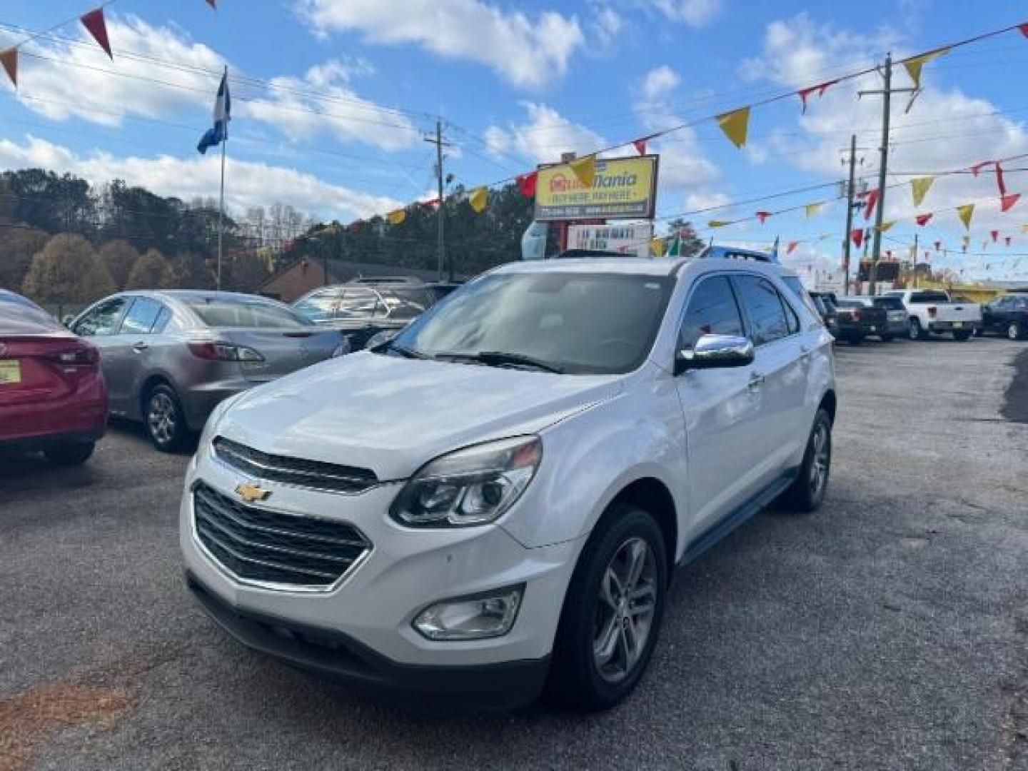 2016 White Chevrolet Equinox LTZ 2WD (2GNALDEKXG1) with an 2.4L L4 DOHC 16V FFV engine, 6-Speed Automatic transmission, located at 1806 Veterans Memorial Hwy SW, Austell, GA, 30168, (770) 944-9558, 33.817959, -84.606987 - Photo#0