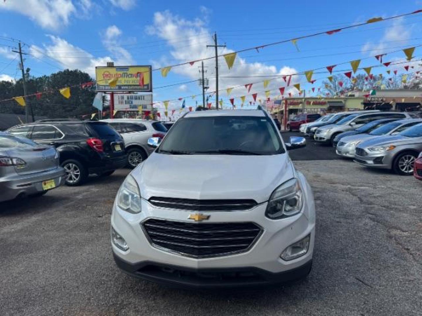 2016 White Chevrolet Equinox LTZ 2WD (2GNALDEKXG1) with an 2.4L L4 DOHC 16V FFV engine, 6-Speed Automatic transmission, located at 1806 Veterans Memorial Hwy SW, Austell, GA, 30168, (770) 944-9558, 33.817959, -84.606987 - Photo#1