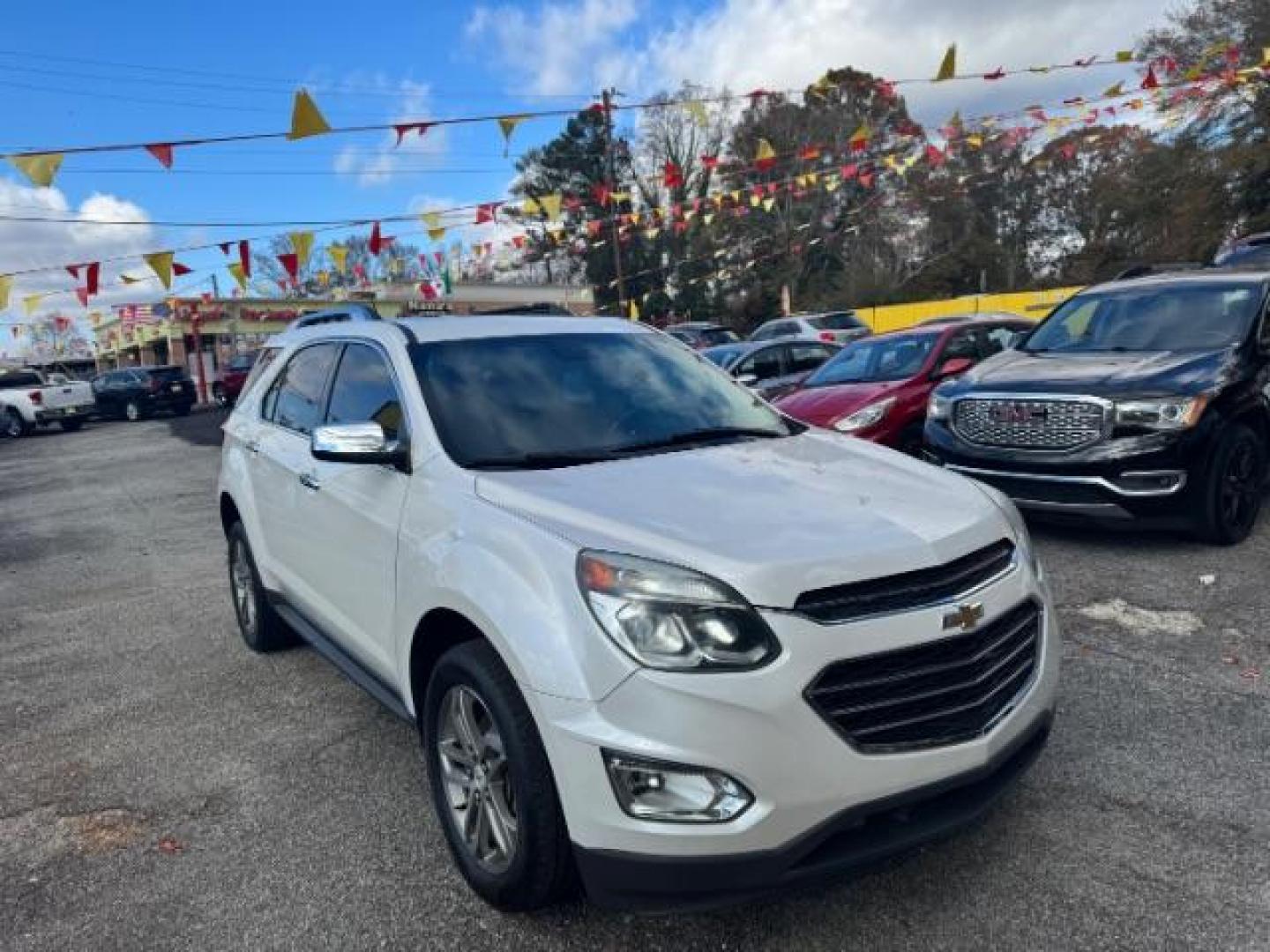 2016 White Chevrolet Equinox LTZ 2WD (2GNALDEKXG1) with an 2.4L L4 DOHC 16V FFV engine, 6-Speed Automatic transmission, located at 1806 Veterans Memorial Hwy SW, Austell, GA, 30168, (770) 944-9558, 33.817959, -84.606987 - Photo#2