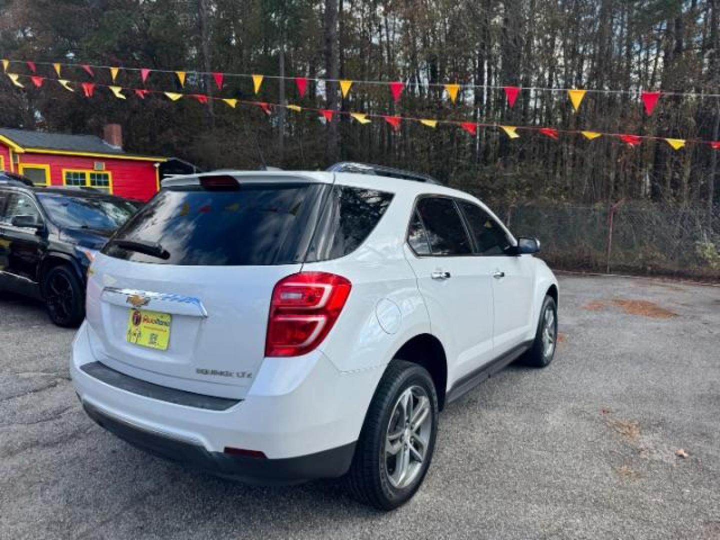 2016 White Chevrolet Equinox LTZ 2WD (2GNALDEKXG1) with an 2.4L L4 DOHC 16V FFV engine, 6-Speed Automatic transmission, located at 1806 Veterans Memorial Hwy SW, Austell, GA, 30168, (770) 944-9558, 33.817959, -84.606987 - Photo#3