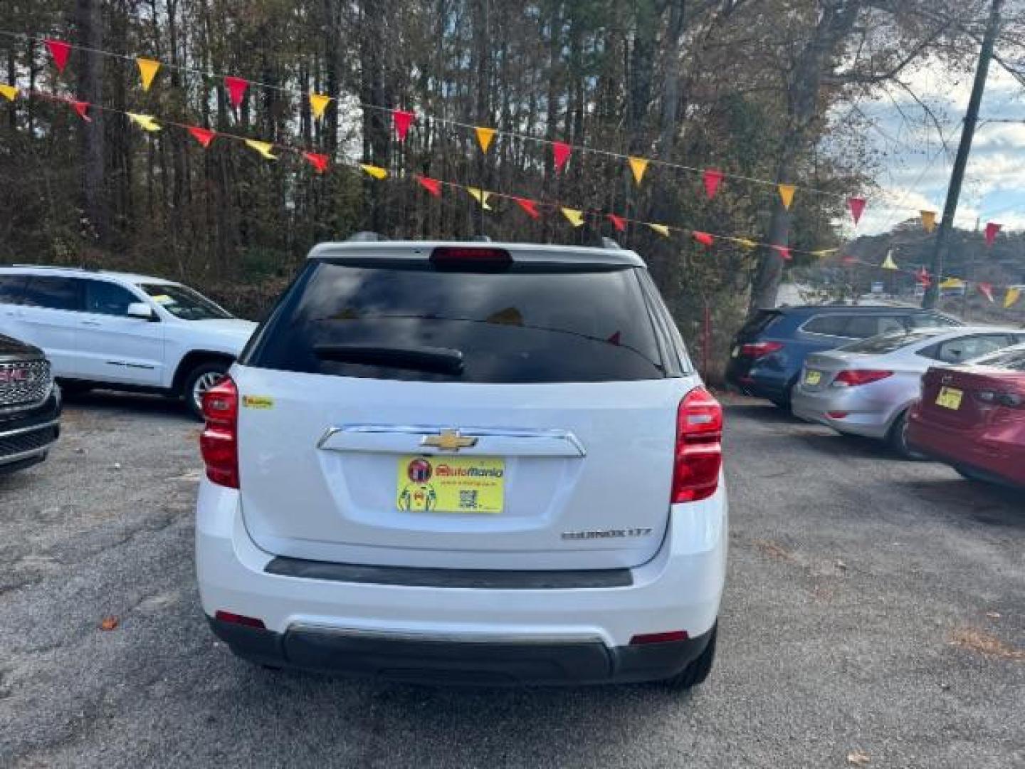 2016 White Chevrolet Equinox LTZ 2WD (2GNALDEKXG1) with an 2.4L L4 DOHC 16V FFV engine, 6-Speed Automatic transmission, located at 1806 Veterans Memorial Hwy SW, Austell, GA, 30168, (770) 944-9558, 33.817959, -84.606987 - Photo#4