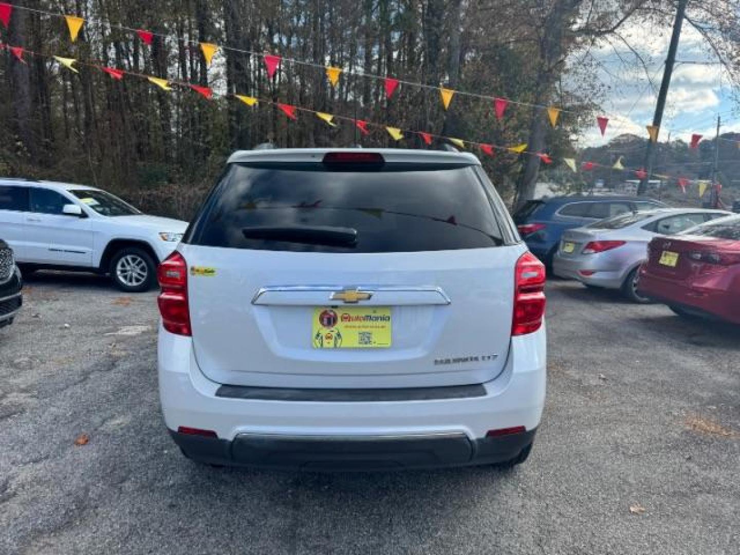 2016 White Chevrolet Equinox LTZ 2WD (2GNALDEKXG1) with an 2.4L L4 DOHC 16V FFV engine, 6-Speed Automatic transmission, located at 1806 Veterans Memorial Hwy SW, Austell, GA, 30168, (770) 944-9558, 33.817959, -84.606987 - Photo#5