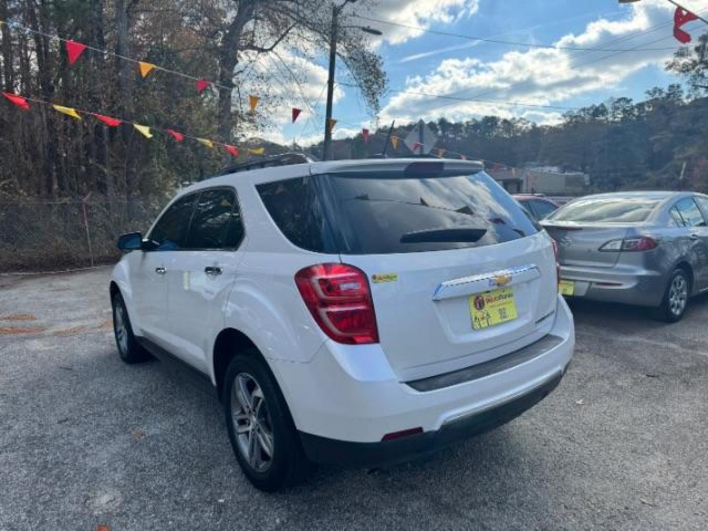 2016 White Chevrolet Equinox LTZ 2WD (2GNALDEKXG1) with an 2.4L L4 DOHC 16V FFV engine, 6-Speed Automatic transmission, located at 1806 Veterans Memorial Hwy SW, Austell, GA, 30168, (770) 944-9558, 33.817959, -84.606987 - Photo#6