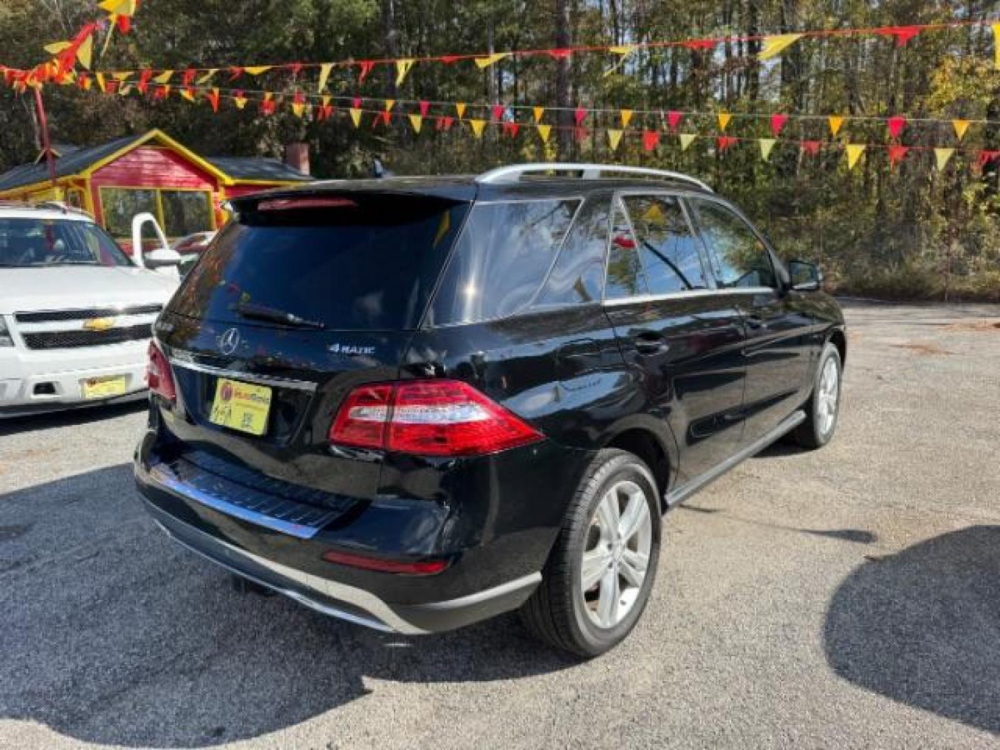 2014 Black Mercedes-Benz M-Class ML350 4MATIC (4JGDA5HB4EA) with an 3.5L V6 DOHC 24V engine, 7-Speed Automatic transmission, located at 1806 Veterans Memorial Hwy SW, Austell, GA, 30168, (770) 944-9558, 33.817959, -84.606987 - Photo#2