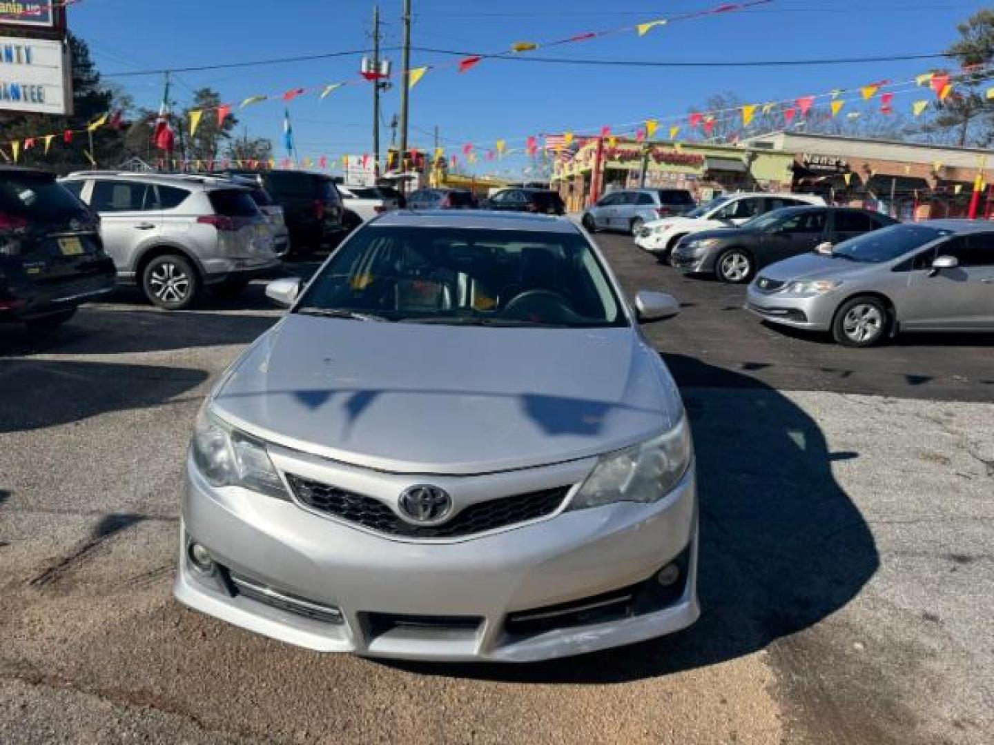 2014 Silver Toyota Camry SE (4T1BF1FK4EU) with an 2.5L L4 DOHC 16V engine, 6-Speed Automatic transmission, located at 1806 Veterans Memorial Hwy SW, Austell, GA, 30168, (770) 944-9558, 33.817959, -84.606987 - Photo#2