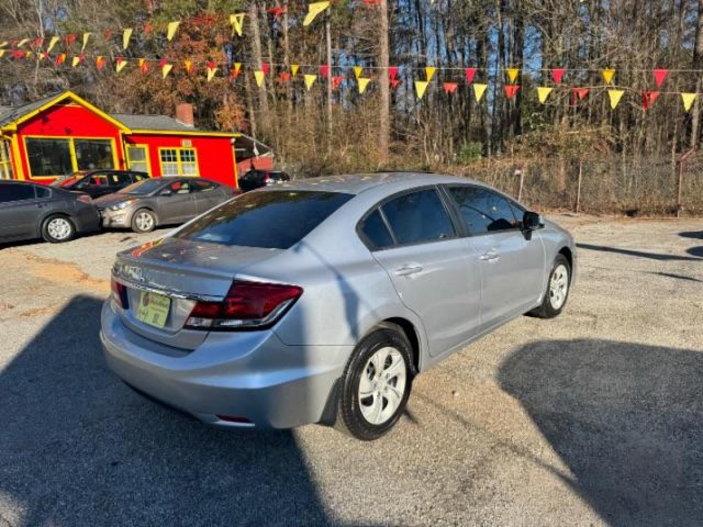 2013 Silver Honda Civic LX Sedan 5-Speed AT (19XFB2F59DE) with an 1.8L L4 SOHC 16V engine, 5-Speed Automatic transmission, located at 1806 Veterans Memorial Hwy SW, Austell, GA, 30168, (770) 944-9558, 33.817959, -84.606987 - Photo#2