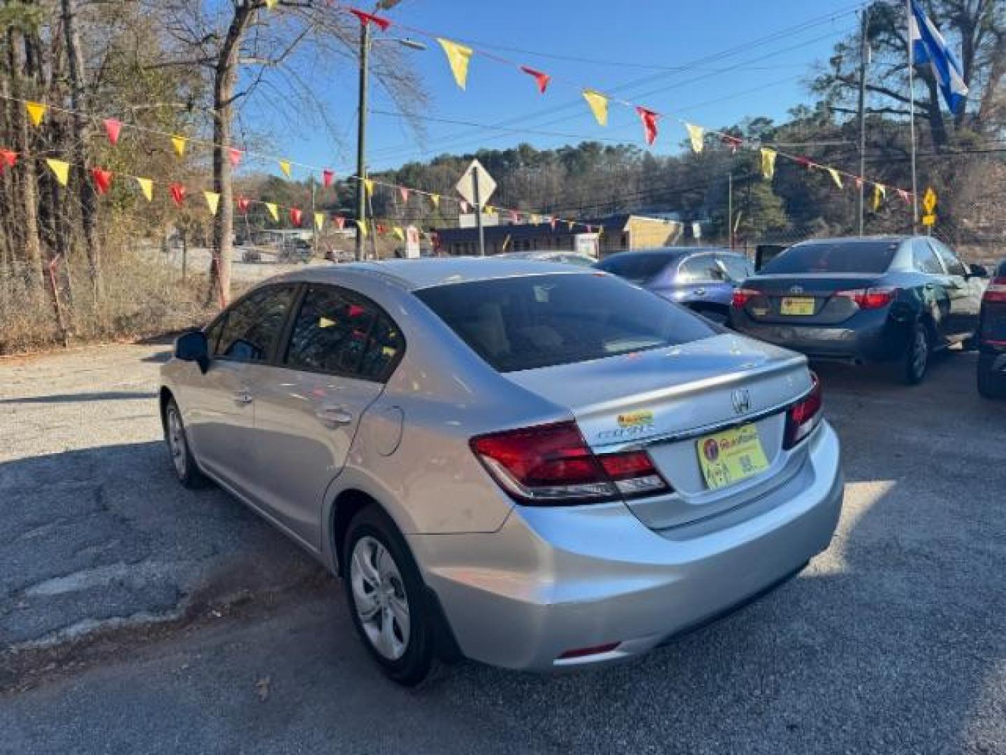 2013 Silver Honda Civic LX Sedan 5-Speed AT (19XFB2F59DE) with an 1.8L L4 SOHC 16V engine, 5-Speed Automatic transmission, located at 1806 Veterans Memorial Hwy SW, Austell, GA, 30168, (770) 944-9558, 33.817959, -84.606987 - Photo#4