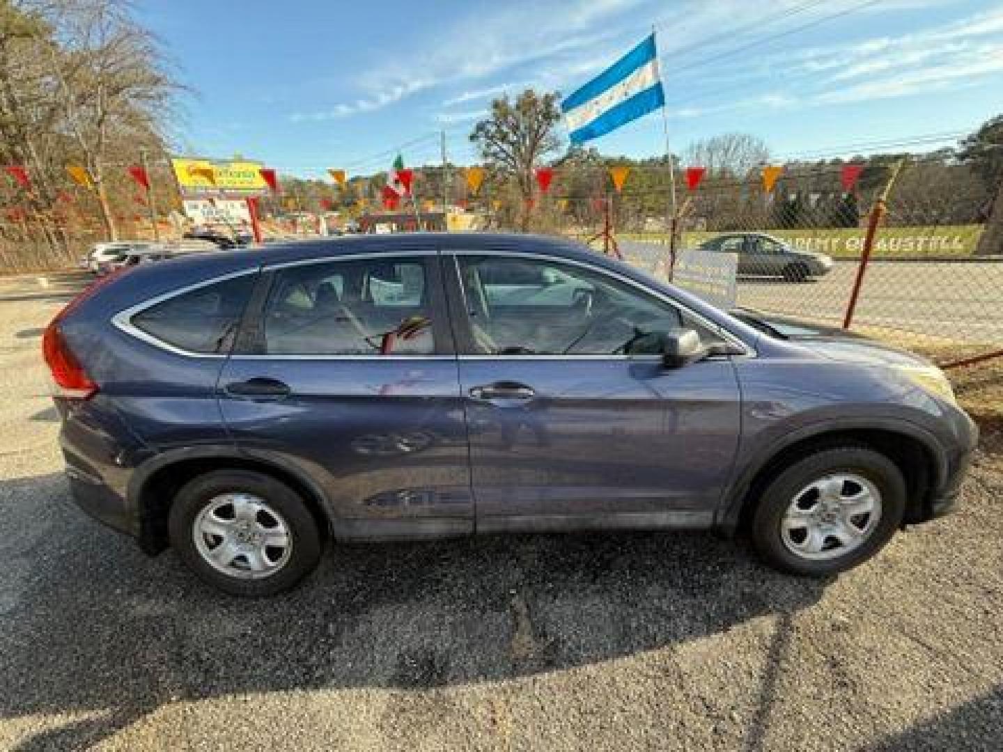 2014 Blue Honda CR-V LX 2WD 5-Speed AT (2HKRM3H35EH) with an 2.4L L4 DOHC 16V engine, 5-Speed Automatic transmission, located at 1806 Veterans Memorial Hwy SW, Austell, GA, 30168, (770) 944-9558, 33.817959, -84.606987 - Photo#7