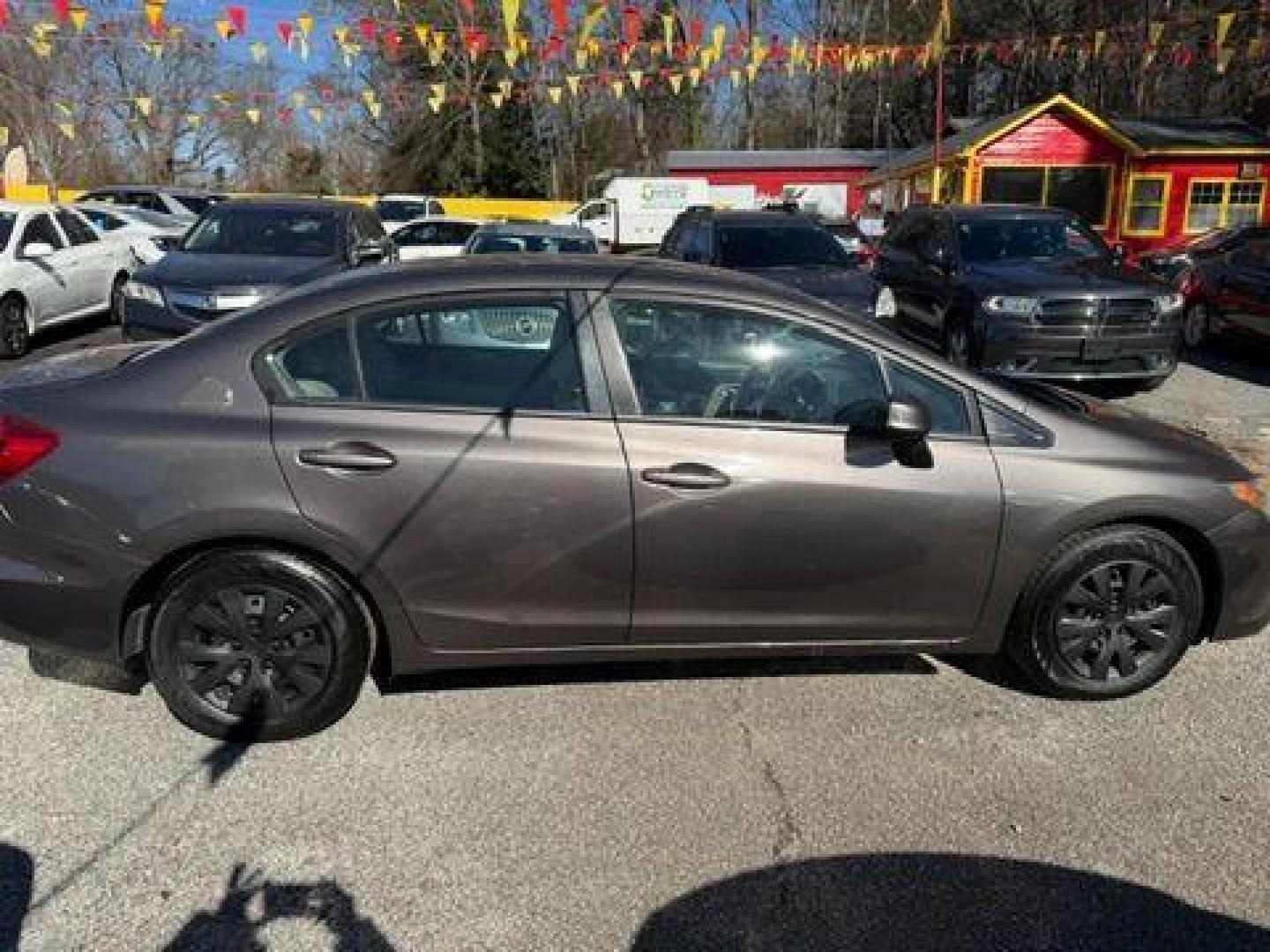 2012 Gray Honda Civic LX Sedan 5-Speed AT (19XFB2F59CE) with an 1.8L L4 SOHC 16V engine, 5-Speed Automatic transmission, located at 1806 Veterans Memorial Hwy SW, Austell, GA, 30168, (770) 944-9558, 33.817959, -84.606987 - Photo#8