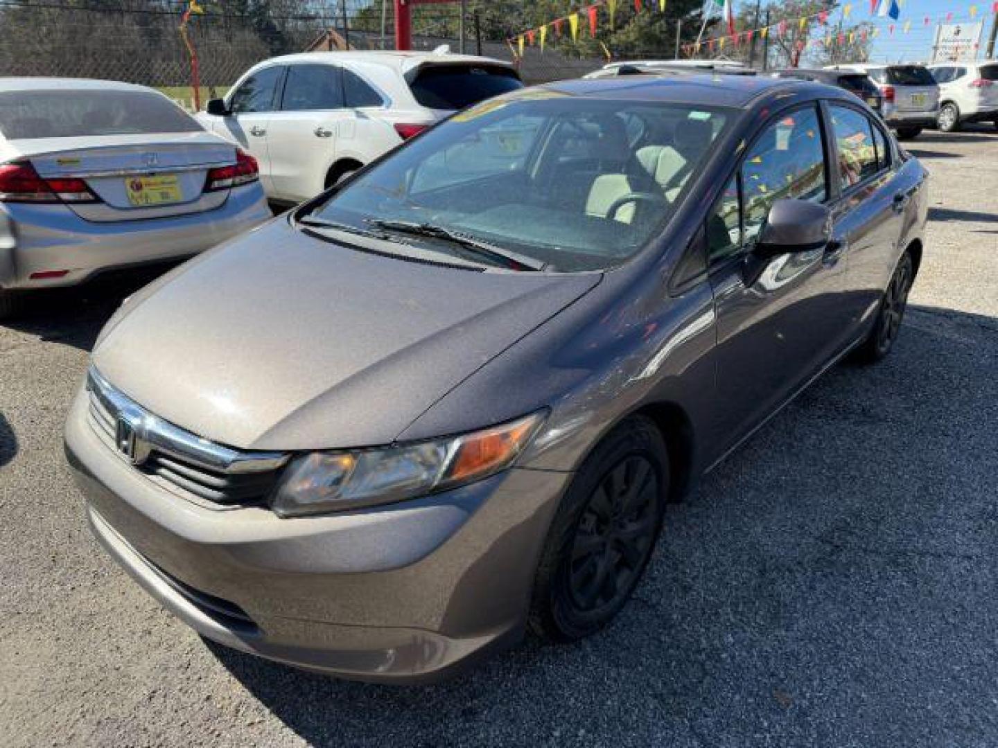 2012 Gray Honda Civic LX Sedan 5-Speed AT (19XFB2F59CE) with an 1.8L L4 SOHC 16V engine, 5-Speed Automatic transmission, located at 1806 Veterans Memorial Hwy SW, Austell, GA, 30168, (770) 944-9558, 33.817959, -84.606987 - Photo#11