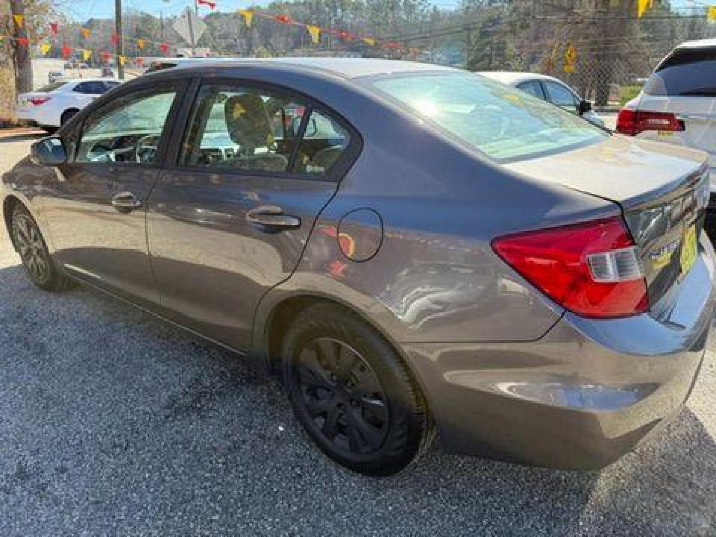 2012 Gray Honda Civic LX Sedan 5-Speed AT (19XFB2F59CE) with an 1.8L L4 SOHC 16V engine, 5-Speed Automatic transmission, located at 1806 Veterans Memorial Hwy SW, Austell, GA, 30168, (770) 944-9558, 33.817959, -84.606987 - Photo#2