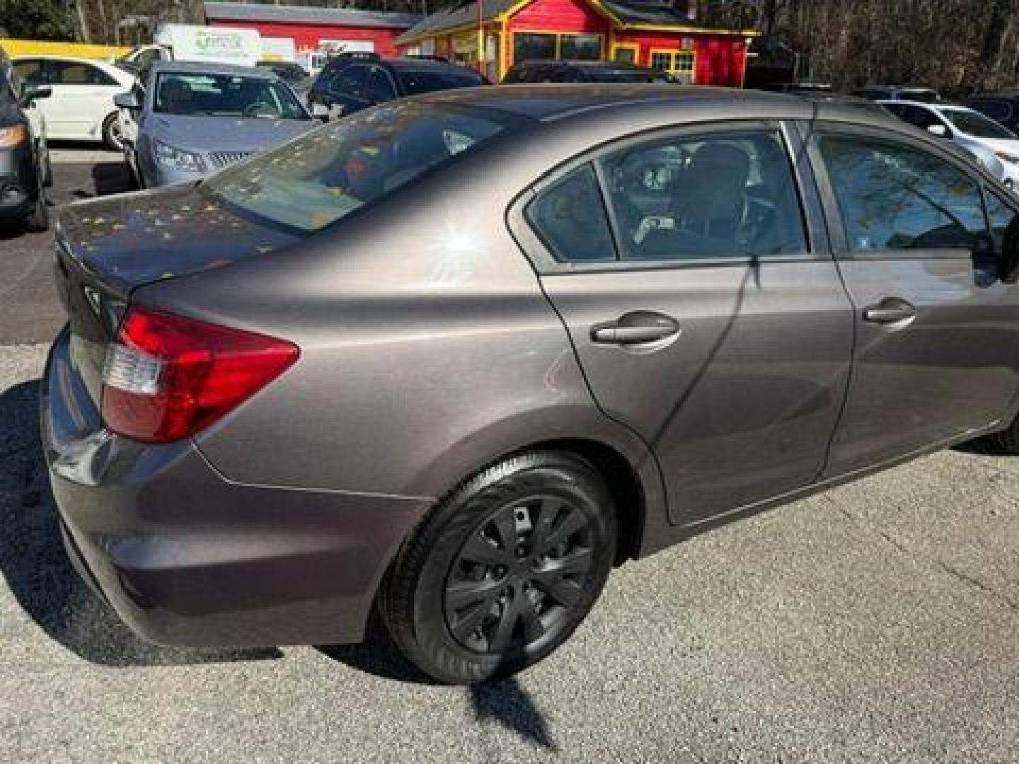 2012 Gray Honda Civic LX Sedan 5-Speed AT (19XFB2F59CE) with an 1.8L L4 SOHC 16V engine, 5-Speed Automatic transmission, located at 1806 Veterans Memorial Hwy SW, Austell, GA, 30168, (770) 944-9558, 33.817959, -84.606987 - Photo#7