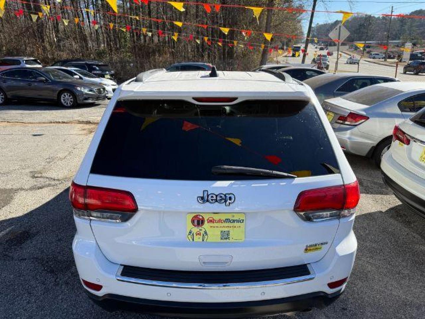 2016 White Jeep Grand Cherokee Limited 2WD (1C4RJEBG9GC) with an 3.6L V6 DOHC 24V engine, 8-Speed Automatic transmission, located at 1806 Veterans Memorial Hwy SW, Austell, GA, 30168, (770) 944-9558, 33.817959, -84.606987 - Photo#5