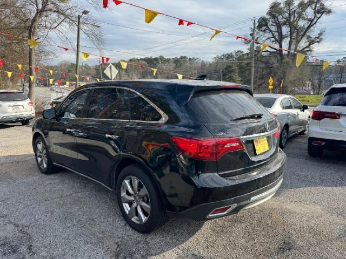 2016 Black Acura MDX 9-Spd AT SH-AWD w/Advance and Entertainment (5FRYD4H99GB) with an 3.5L V6 SOHC 24V engine, 9-Speed Automatic transmission, located at 1806 Veterans Memorial Hwy SW, Austell, GA, 30168, (770) 944-9558, 33.817959, -84.606987 - Photo#4