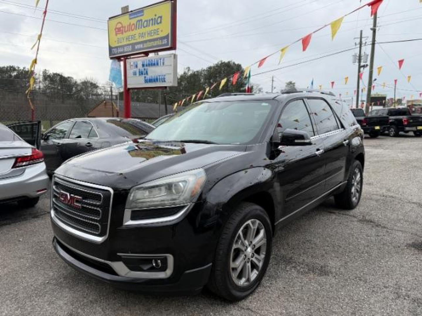 2016 Black GMC Acadia SLT-1 FWD (1GKKRRKD6GJ) with an 3.6L V6 DOHC 24V engine, 6-Speed Automatic transmission, located at 1806 Veterans Memorial Hwy SW, Austell, GA, 30168, (770) 944-9558, 33.817959, -84.606987 - Photo#0