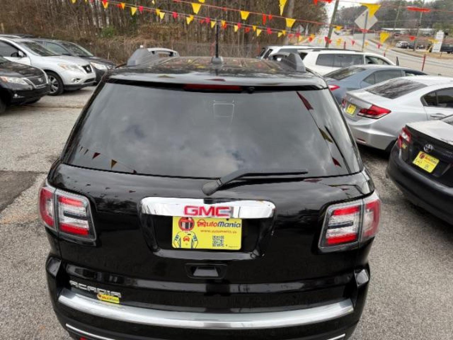 2016 Black GMC Acadia SLT-1 FWD (1GKKRRKD6GJ) with an 3.6L V6 DOHC 24V engine, 6-Speed Automatic transmission, located at 1806 Veterans Memorial Hwy SW, Austell, GA, 30168, (770) 944-9558, 33.817959, -84.606987 - Photo#4