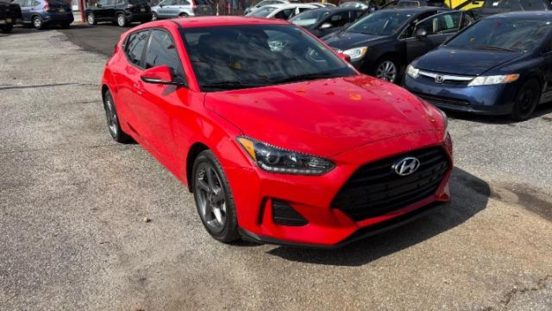 2019 Red Hyundai Veloster 2.0 6A (KMHTG6AF7KU) with an 2.0L L4 DOHC 16V engine, 6-Speed Automatic transmission, located at 1806 Veterans Memorial Hwy SW, Austell, GA, 30168, (770) 944-9558, 33.817959, -84.606987 - Photo#0