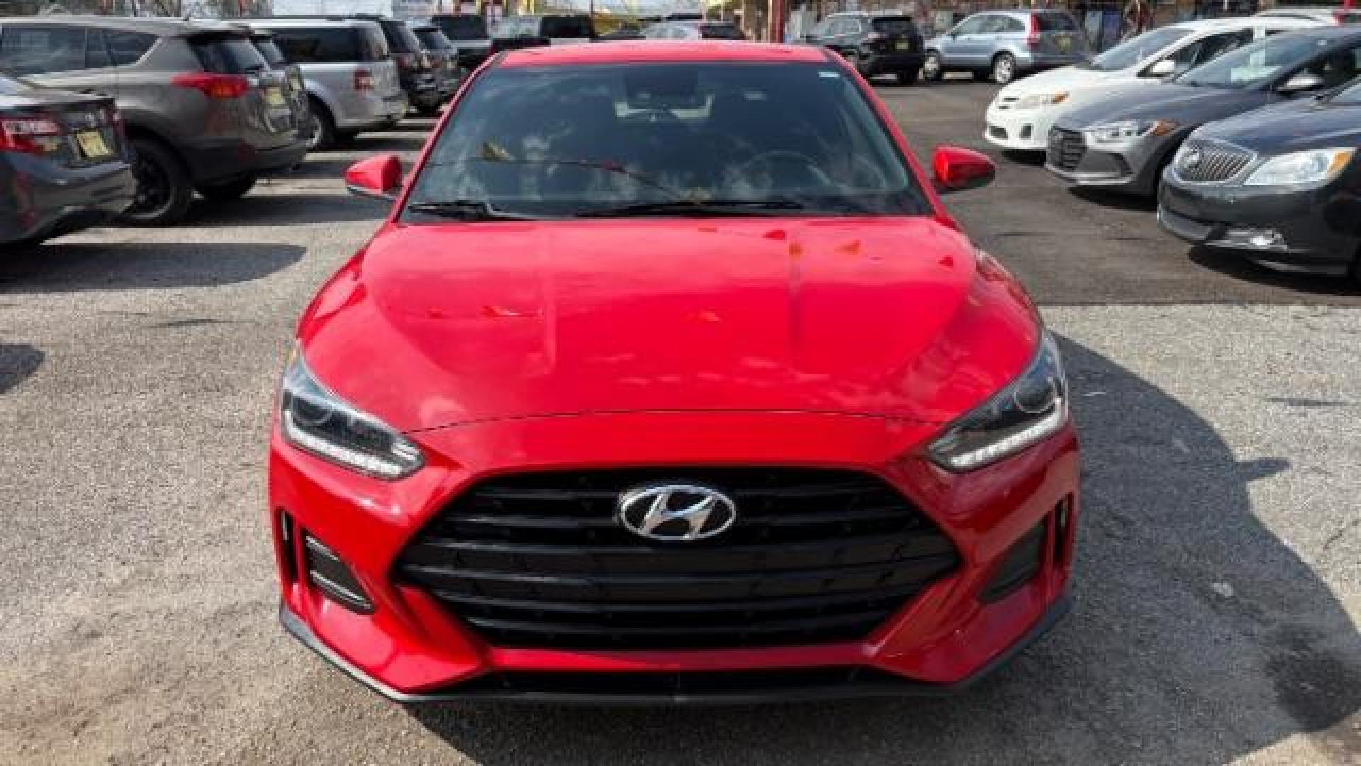 2019 Red Hyundai Veloster 2.0 6A (KMHTG6AF7KU) with an 2.0L L4 DOHC 16V engine, 6-Speed Automatic transmission, located at 1806 Veterans Memorial Hwy SW, Austell, GA, 30168, (770) 944-9558, 33.817959, -84.606987 - Photo#1