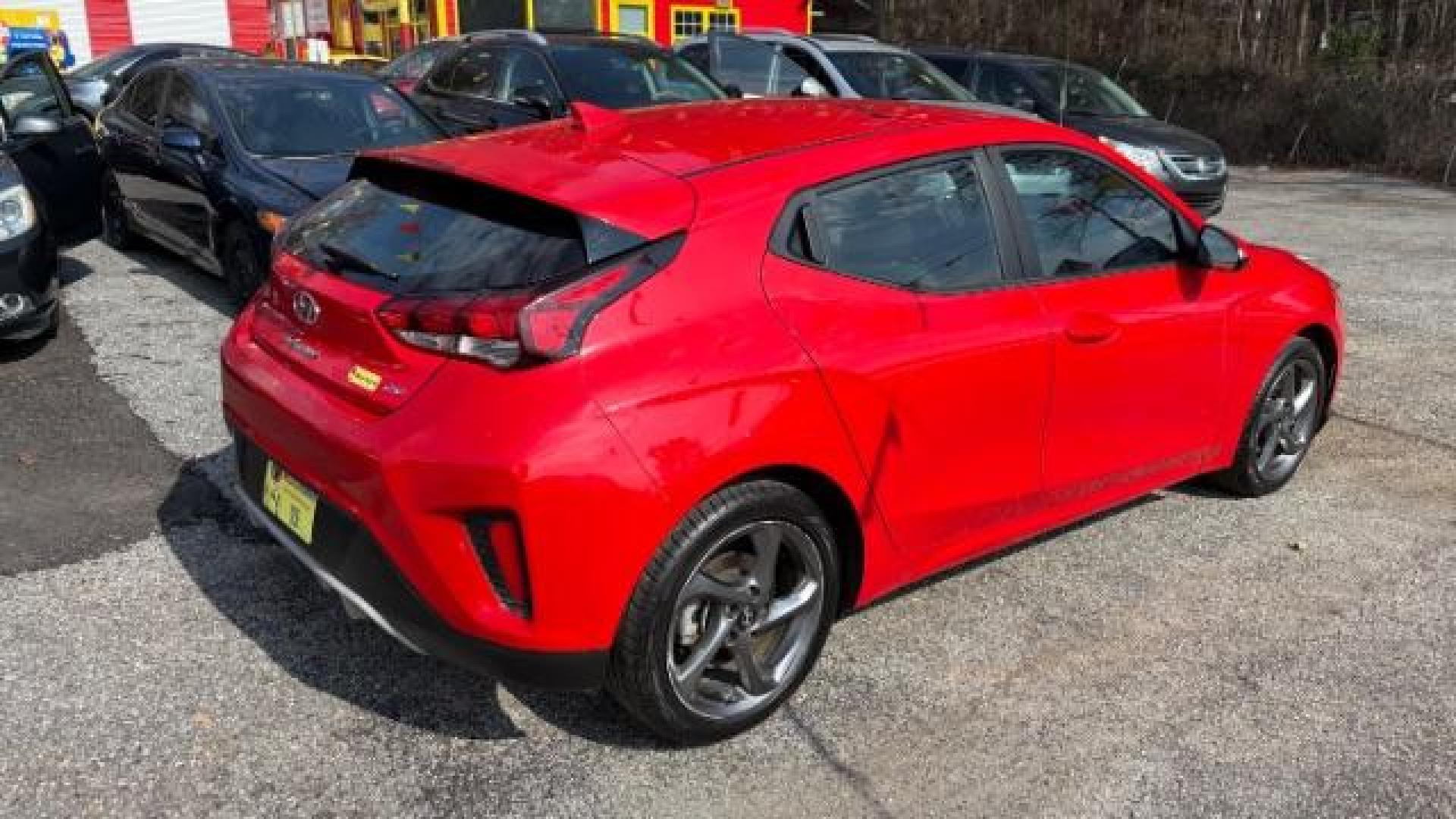 2019 Red Hyundai Veloster 2.0 6A (KMHTG6AF7KU) with an 2.0L L4 DOHC 16V engine, 6-Speed Automatic transmission, located at 1806 Veterans Memorial Hwy SW, Austell, GA, 30168, (770) 944-9558, 33.817959, -84.606987 - Photo#2