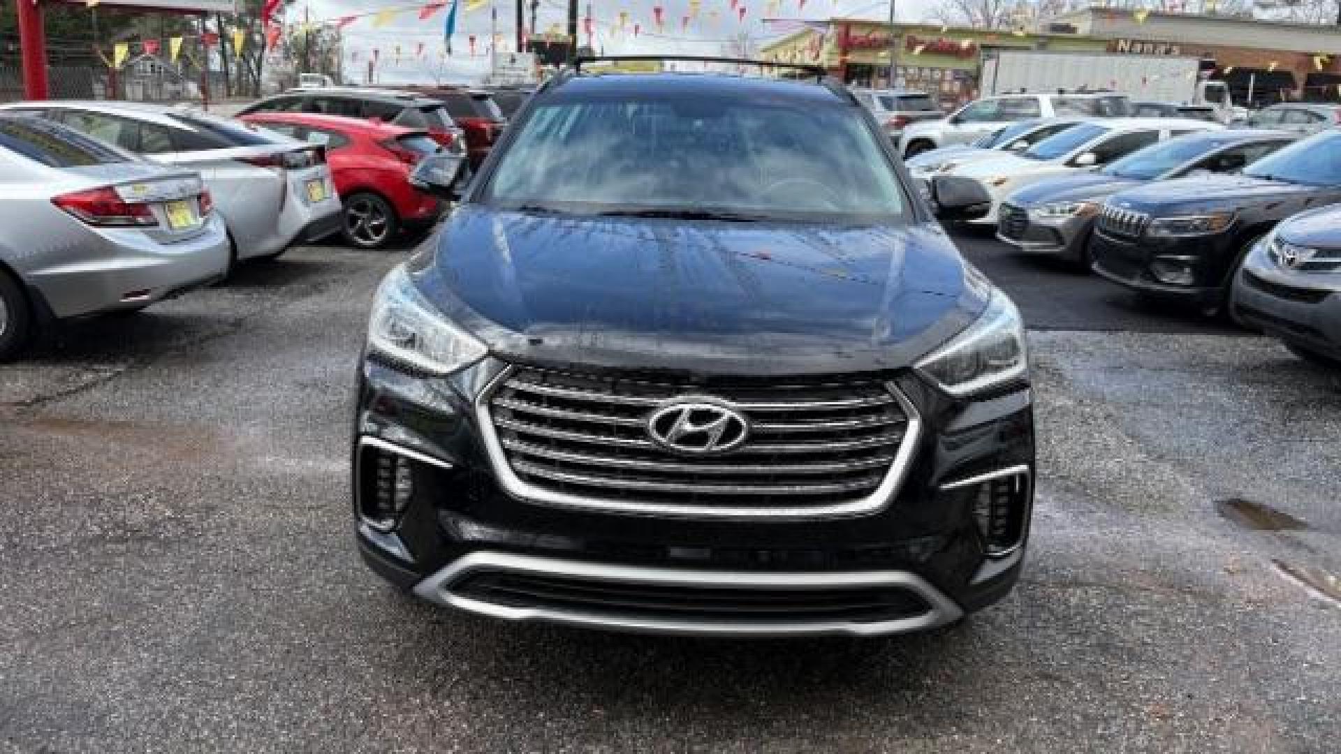 2018 Black Hyundai Santa Fe SE Ultimate (KM8SN4HF4JU) with an 3.3L V6 DOHC 24V engine, 6-Speed Automatic transmission, located at 1806 Veterans Memorial Hwy SW, Austell, GA, 30168, (770) 944-9558, 33.817959, -84.606987 - Photo#1