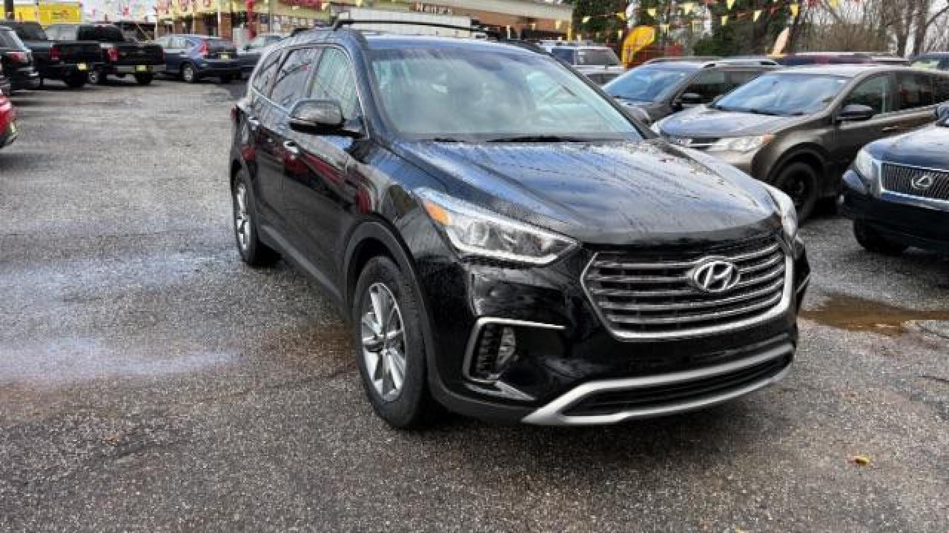 2018 Black Hyundai Santa Fe SE Ultimate (KM8SN4HF4JU) with an 3.3L V6 DOHC 24V engine, 6-Speed Automatic transmission, located at 1806 Veterans Memorial Hwy SW, Austell, GA, 30168, (770) 944-9558, 33.817959, -84.606987 - Photo#2