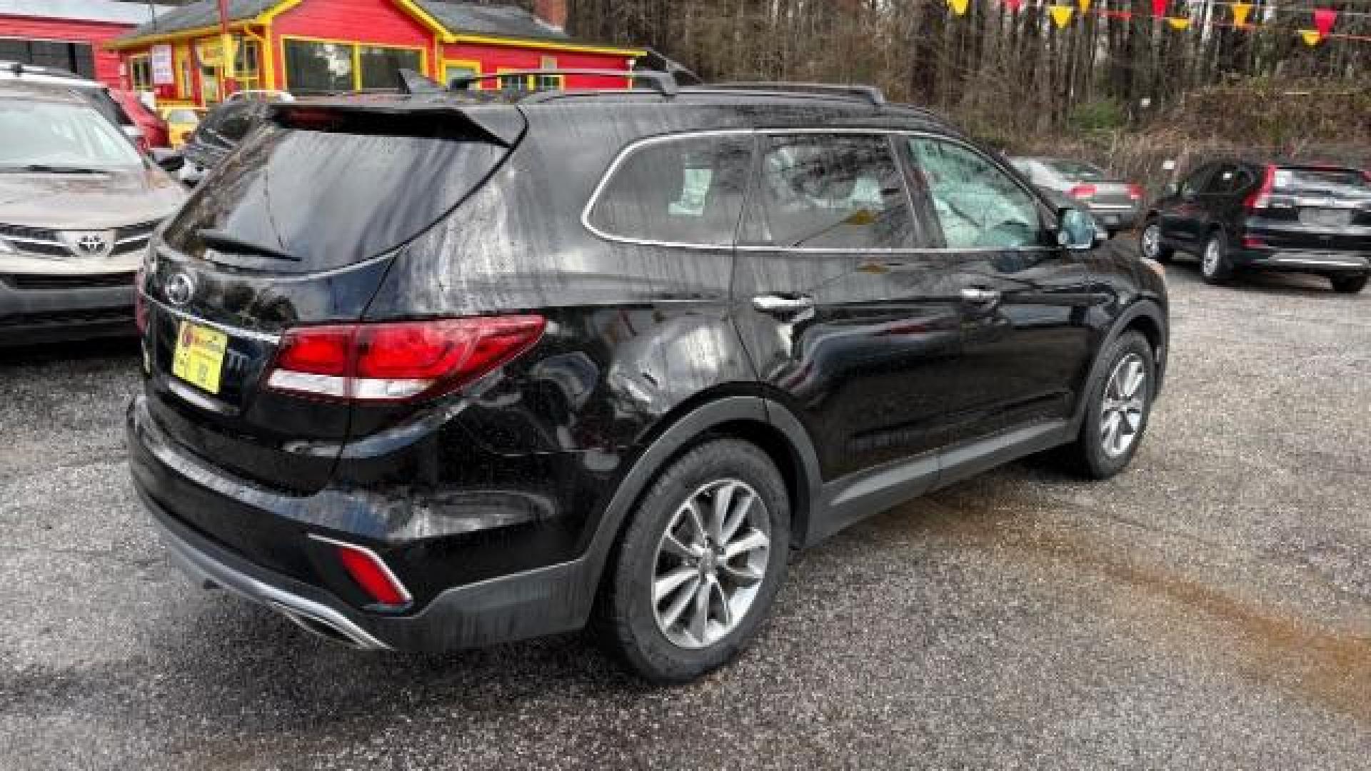 2018 Black Hyundai Santa Fe SE Ultimate (KM8SN4HF4JU) with an 3.3L V6 DOHC 24V engine, 6-Speed Automatic transmission, located at 1806 Veterans Memorial Hwy SW, Austell, GA, 30168, (770) 944-9558, 33.817959, -84.606987 - Photo#3