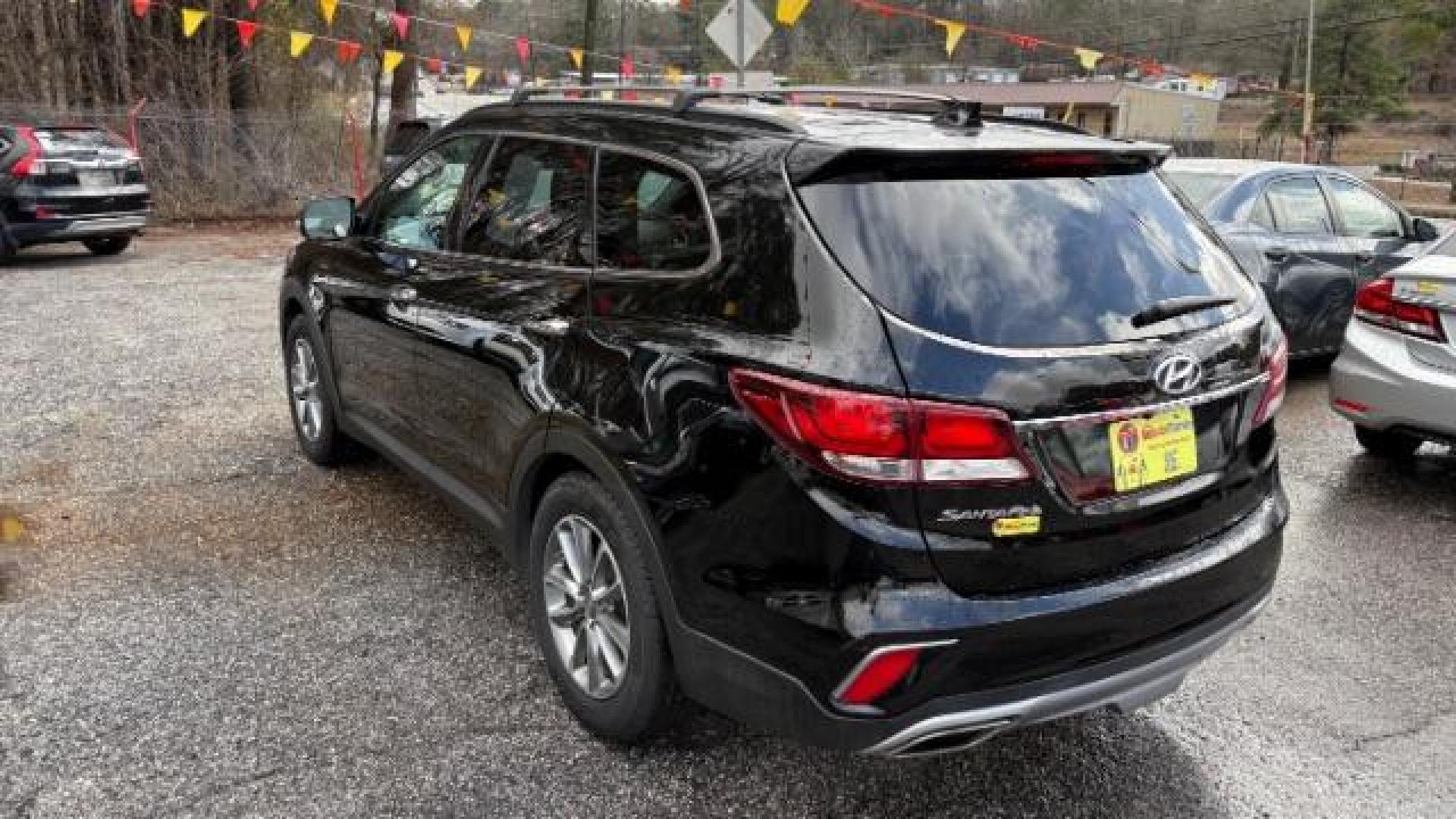 2018 Black Hyundai Santa Fe SE Ultimate (KM8SN4HF4JU) with an 3.3L V6 DOHC 24V engine, 6-Speed Automatic transmission, located at 1806 Veterans Memorial Hwy SW, Austell, GA, 30168, (770) 944-9558, 33.817959, -84.606987 - Photo#4