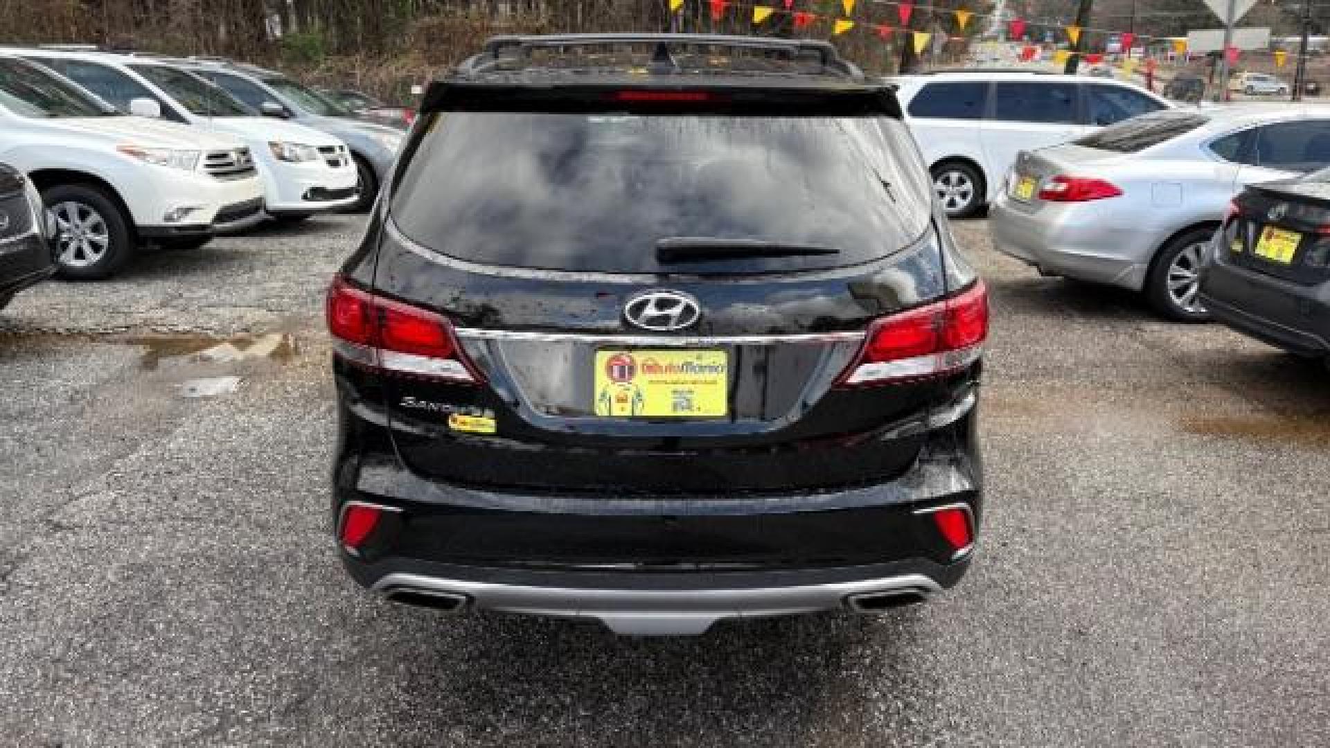 2018 Black Hyundai Santa Fe SE Ultimate (KM8SN4HF4JU) with an 3.3L V6 DOHC 24V engine, 6-Speed Automatic transmission, located at 1806 Veterans Memorial Hwy SW, Austell, GA, 30168, (770) 944-9558, 33.817959, -84.606987 - Photo#5