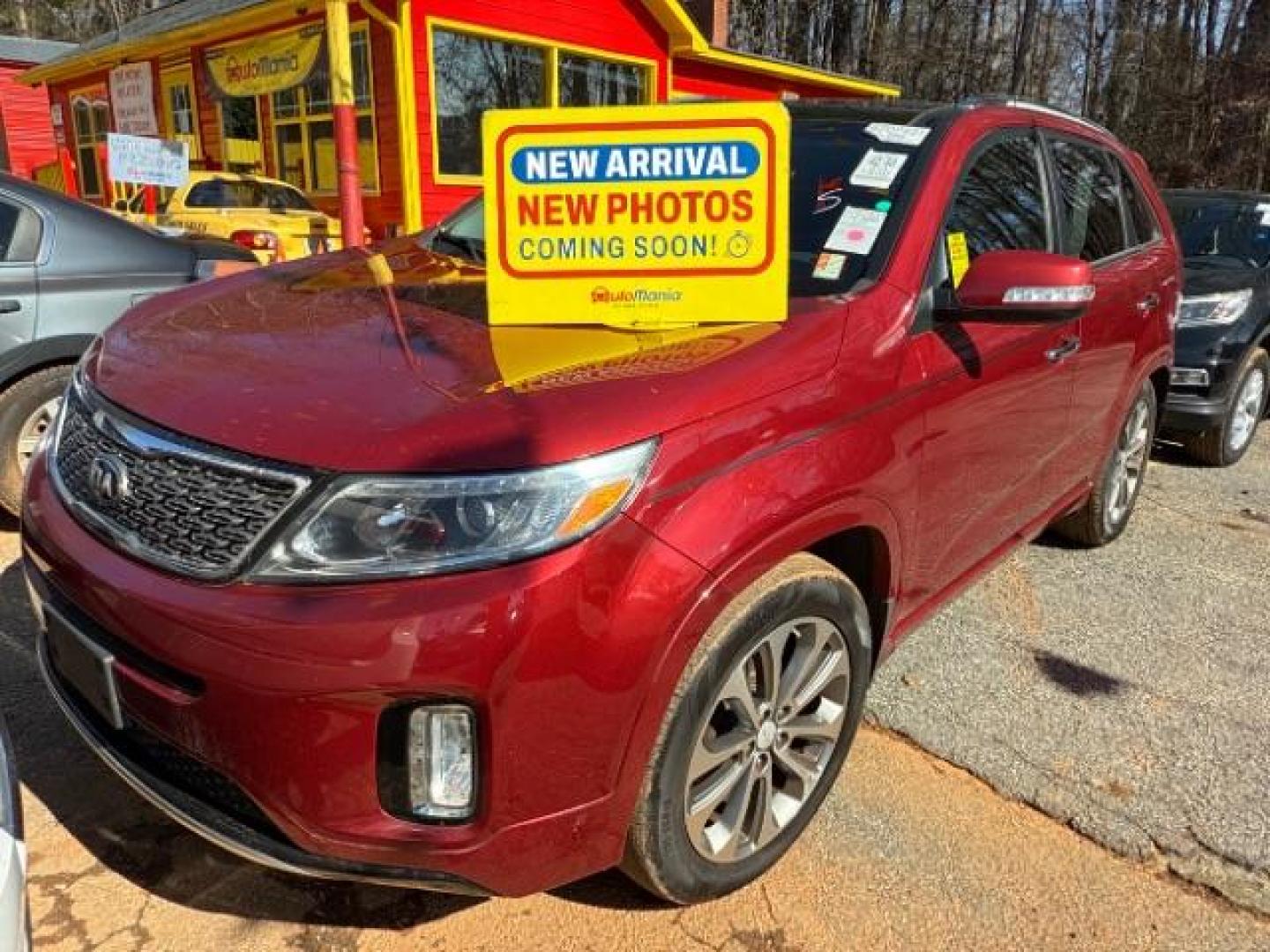 2015 Red Kia Sorento SX V6 FWD (5XYKW4A71FG) with an 3.3L V6 DOHC 24V engine, 6-Speed Automatic transmission, located at 1806 Veterans Memorial Hwy SW, Austell, GA, 30168, (770) 944-9558, 33.817959, -84.606987 - Photo#0