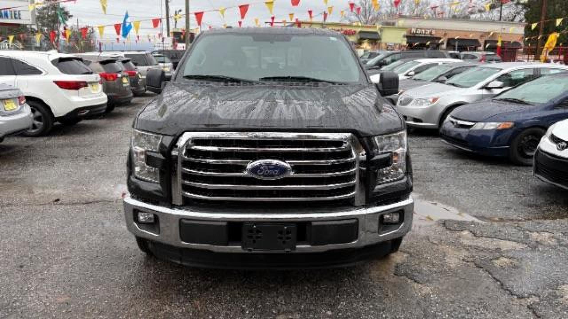 2015 Black Ford F-150 XLT SuperCrew 6.5-ft. Bed 2WD (1FTEW1CPXFF) with an 2.7L V6 DOHC 24V engine, 6-Speed Automatic transmission, located at 1806 Veterans Memorial Hwy SW, Austell, GA, 30168, (770) 944-9558, 33.817959, -84.606987 - Photo#1