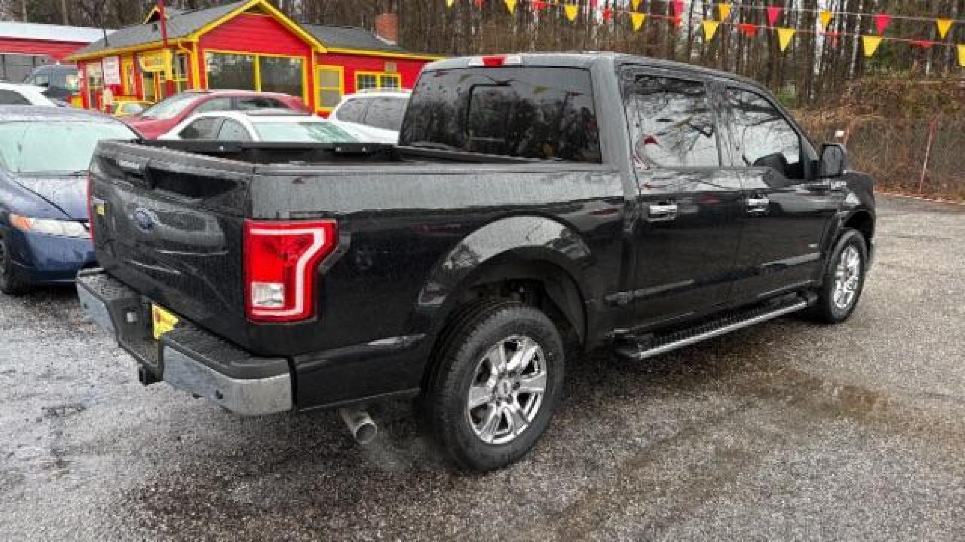 2015 Black Ford F-150 XLT SuperCrew 6.5-ft. Bed 2WD (1FTEW1CPXFF) with an 2.7L V6 DOHC 24V engine, 6-Speed Automatic transmission, located at 1806 Veterans Memorial Hwy SW, Austell, GA, 30168, (770) 944-9558, 33.817959, -84.606987 - Photo#3