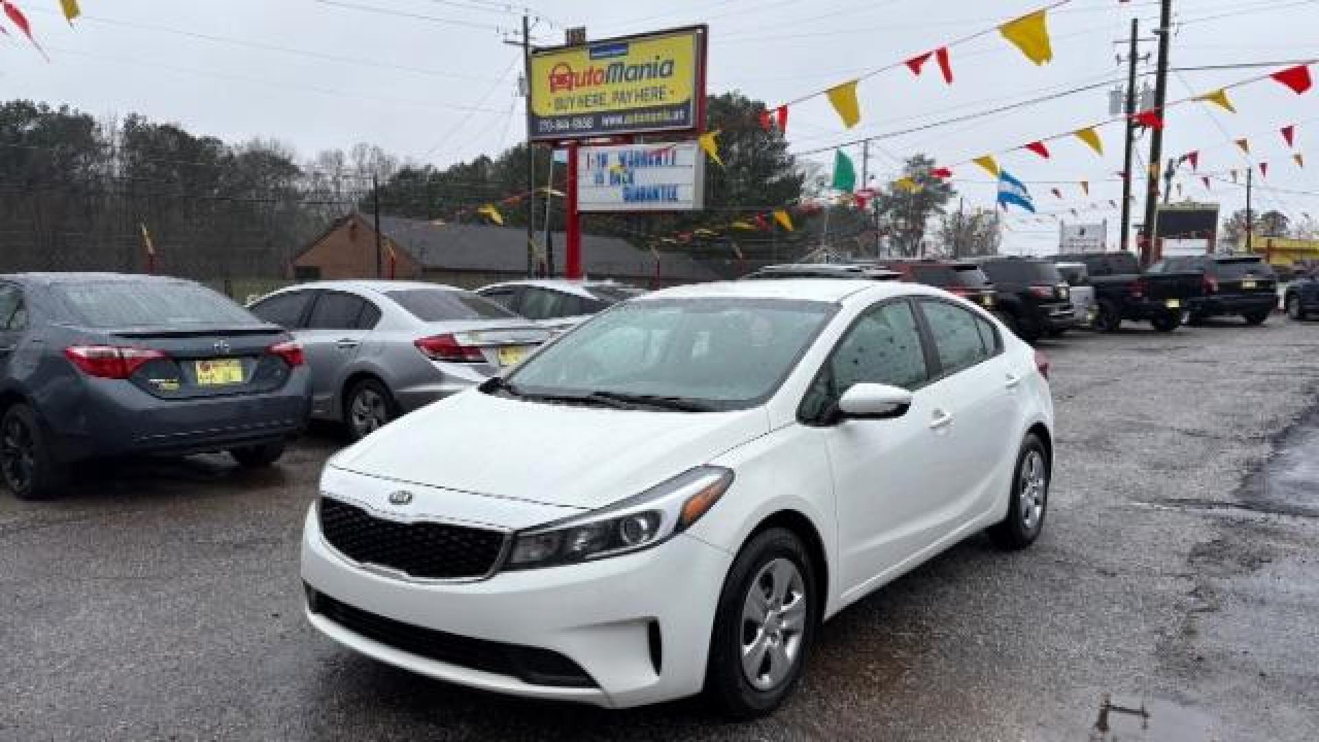 2017 White Kia Forte LX 6A (3KPFK4A78HE) with an 2.0L L4 DOHC 16V engine, 6-Speed Automatic transmission, located at 1806 Veterans Memorial Hwy SW, Austell, GA, 30168, (770) 944-9558, 33.817959, -84.606987 - Photo#0