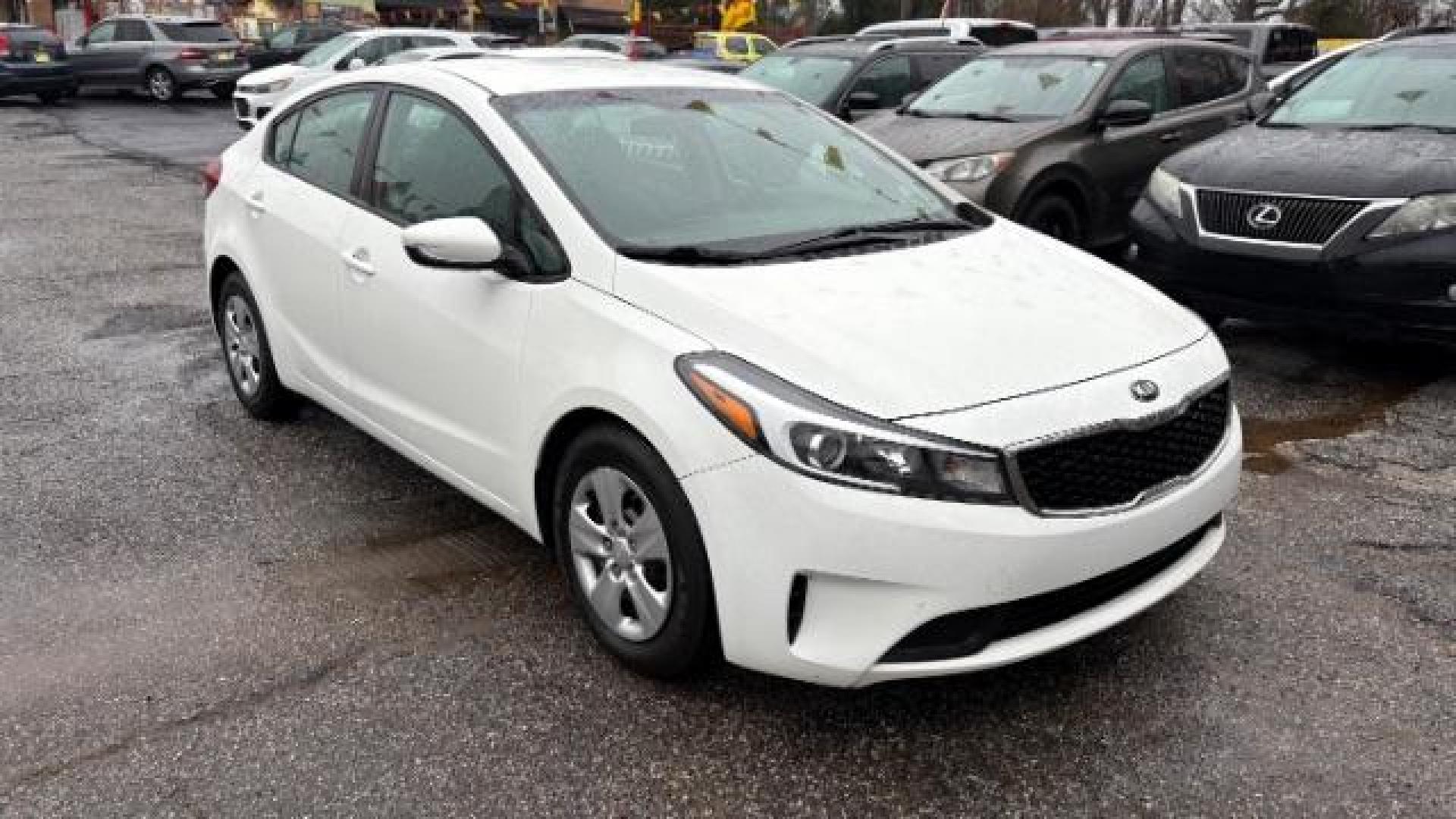 2017 White Kia Forte LX 6A (3KPFK4A78HE) with an 2.0L L4 DOHC 16V engine, 6-Speed Automatic transmission, located at 1806 Veterans Memorial Hwy SW, Austell, GA, 30168, (770) 944-9558, 33.817959, -84.606987 - Photo#2