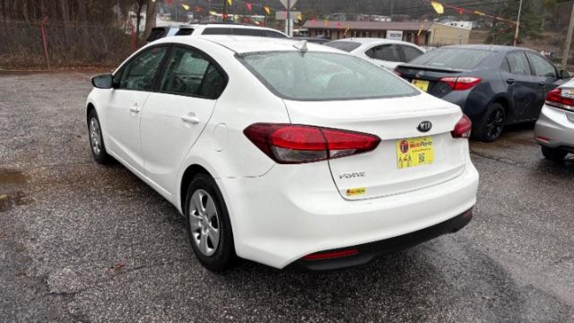 2017 White Kia Forte LX 6A (3KPFK4A78HE) with an 2.0L L4 DOHC 16V engine, 6-Speed Automatic transmission, located at 1806 Veterans Memorial Hwy SW, Austell, GA, 30168, (770) 944-9558, 33.817959, -84.606987 - Photo#5